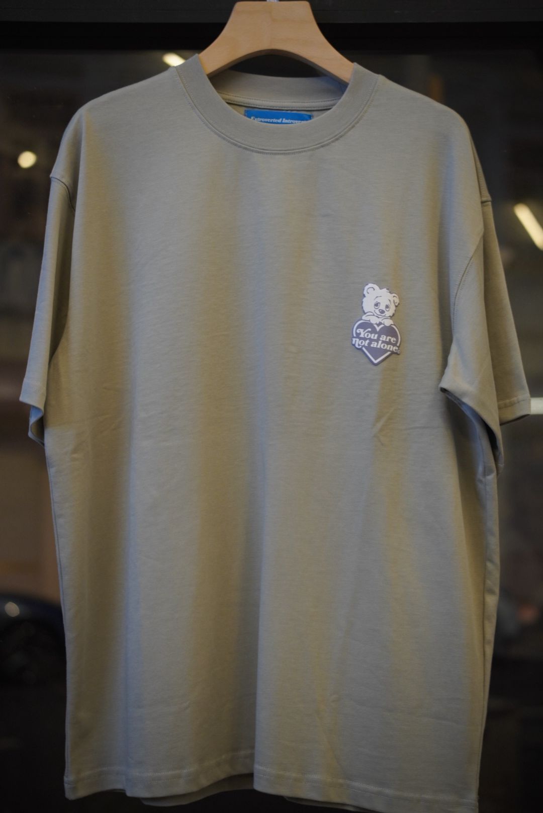 A Eckhaus Latta Shirt pictured on a model in front of a white background. The title of the product is Eckhaus Latta Eclipse Turtleneck - Stone and the image was taken by 199A®.