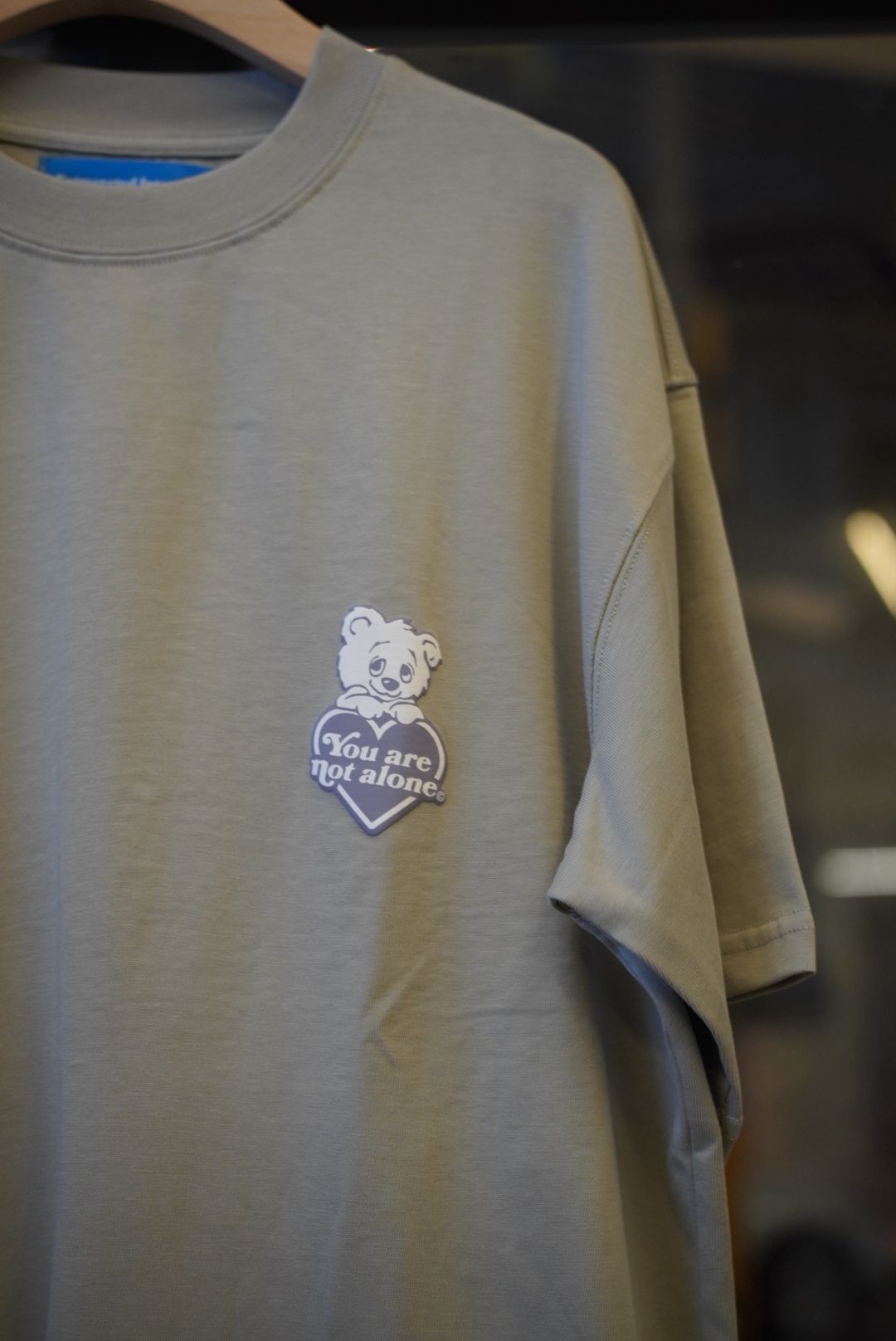 A Eckhaus Latta Shirt pictured on a model in front of a white background. The title of the product is Eckhaus Latta Eclipse Turtleneck - Stone and the image was taken by 199A®.