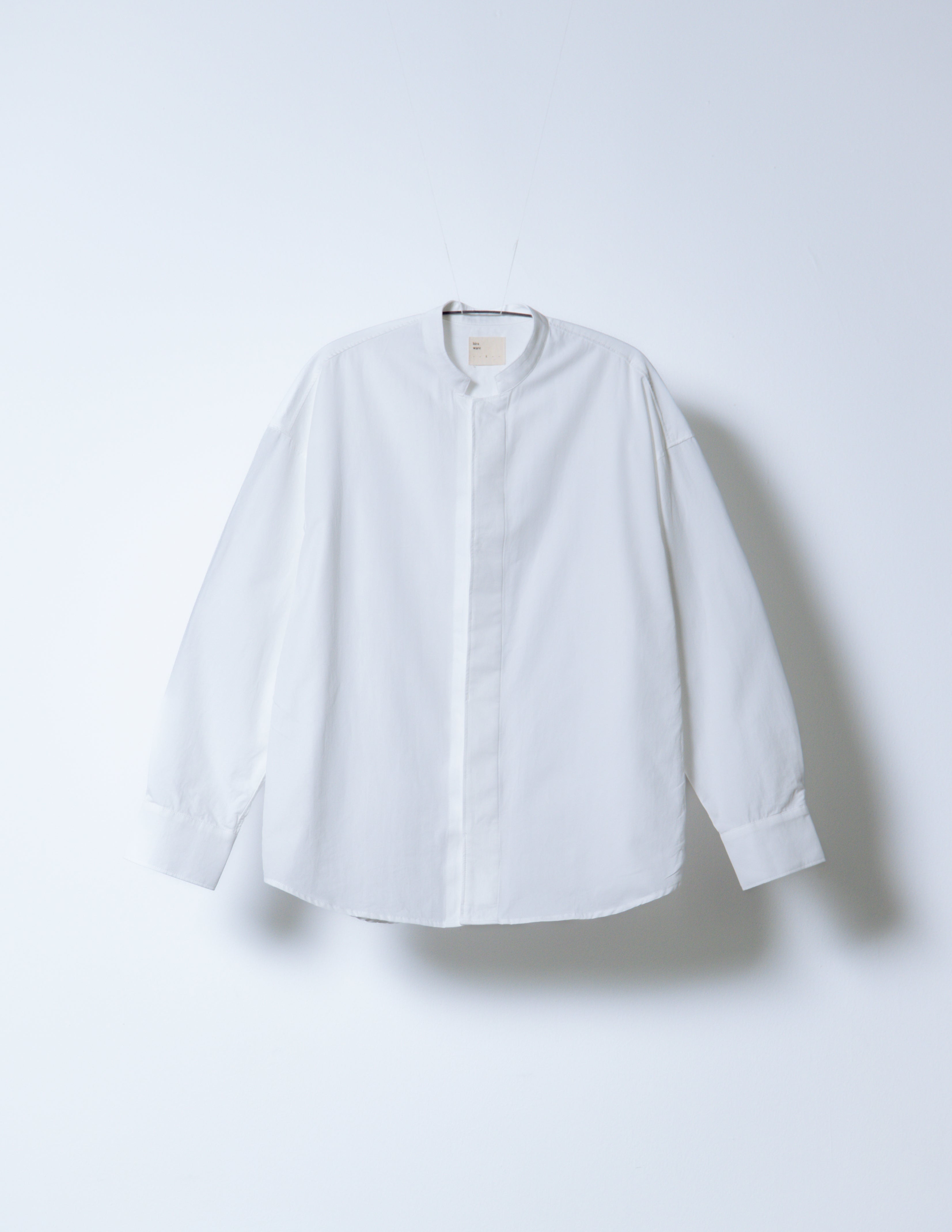 A Eckhaus Latta Shirt pictured on a model in front of a white background. The title of the product is Eckhaus Latta Eclipse Turtleneck - Stone and the image was taken by 199A®.