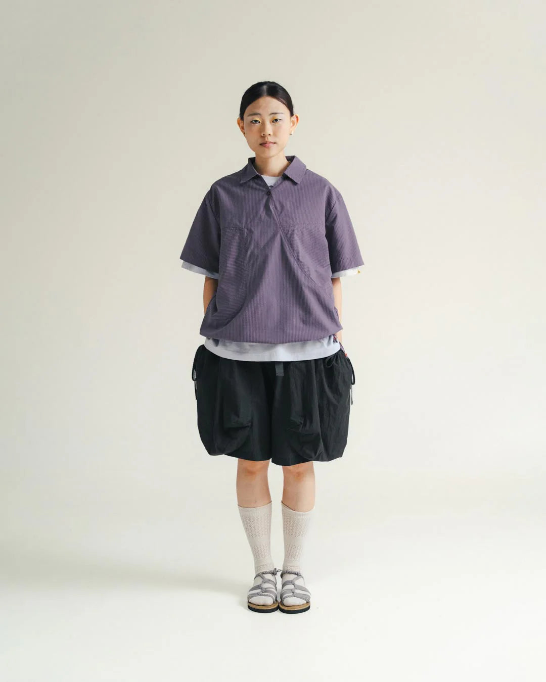A Eckhaus Latta Shirt pictured on a model in front of a white background. The title of the product is Eckhaus Latta Eclipse Turtleneck - Stone and the image was taken by 199A®.