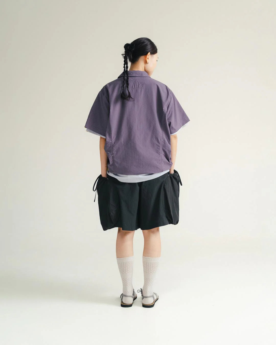 A Eckhaus Latta Shirt pictured on a model in front of a white background. The title of the product is Eckhaus Latta Eclipse Turtleneck - Stone and the image was taken by 199A®.