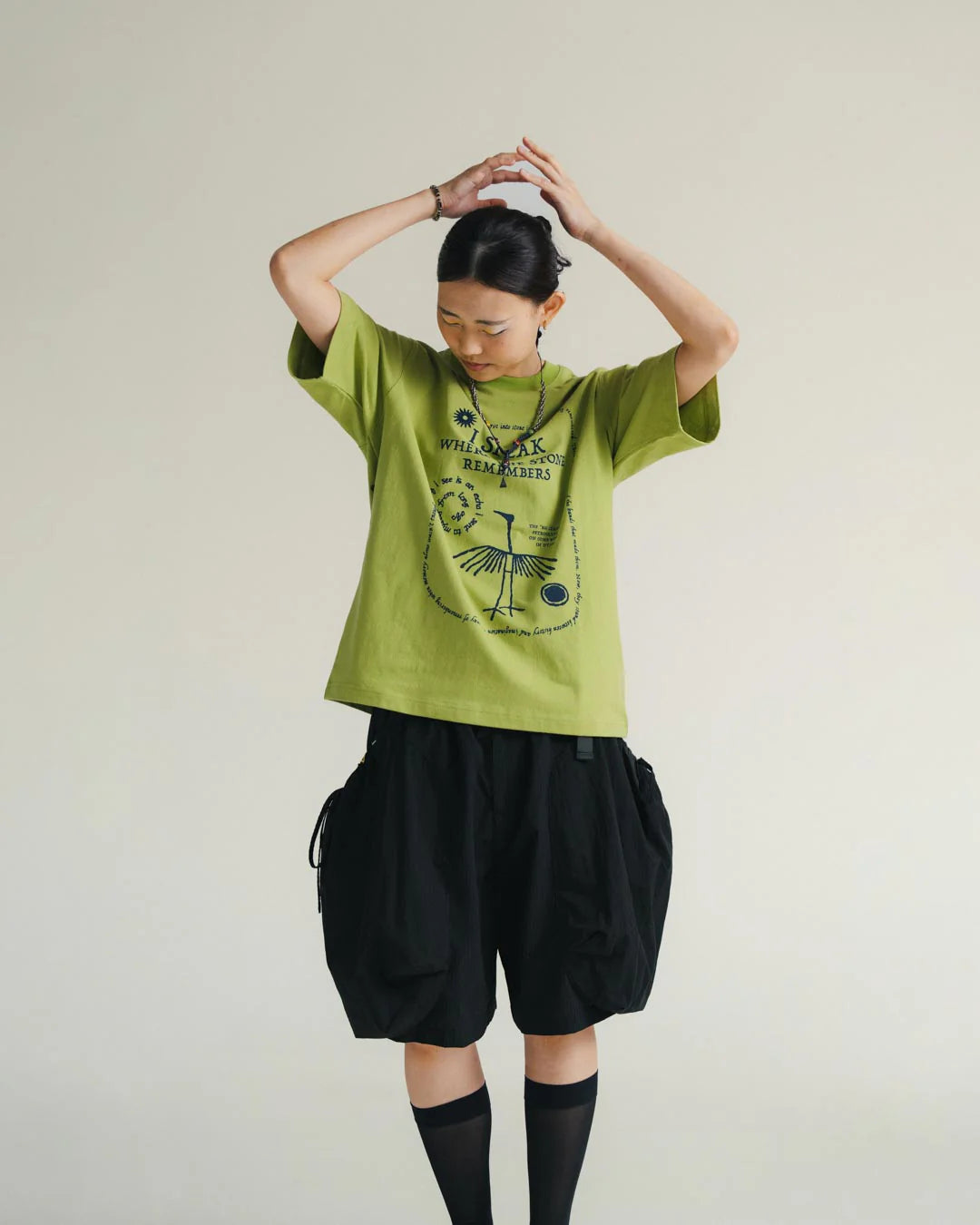 A Eckhaus Latta Shirt pictured on a model in front of a white background. The title of the product is Eckhaus Latta Eclipse Turtleneck - Stone and the image was taken by 199A®.
