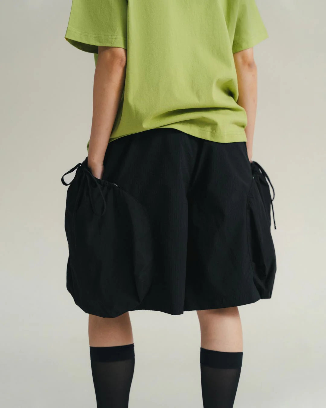 A Eckhaus Latta Shirt pictured on a model in front of a white background. The title of the product is Eckhaus Latta Eclipse Turtleneck - Stone and the image was taken by 199A®.