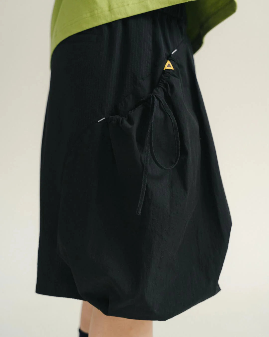 A Eckhaus Latta Shirt pictured on a model in front of a white background. The title of the product is Eckhaus Latta Eclipse Turtleneck - Stone and the image was taken by 199A®.