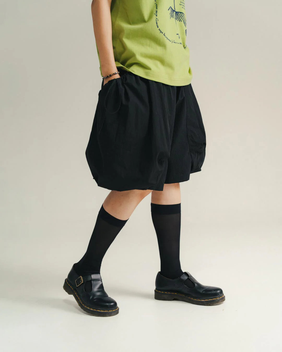 A Eckhaus Latta Shirt pictured on a model in front of a white background. The title of the product is Eckhaus Latta Eclipse Turtleneck - Stone and the image was taken by 199A®.