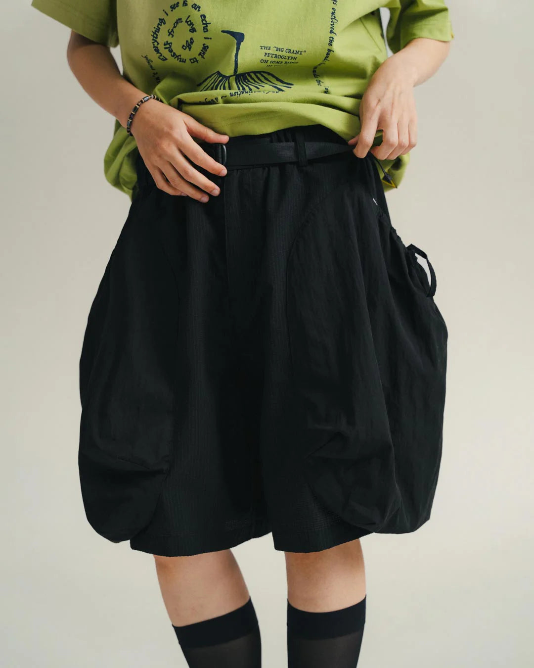 A Eckhaus Latta Shirt pictured on a model in front of a white background. The title of the product is Eckhaus Latta Eclipse Turtleneck - Stone and the image was taken by 199A®.