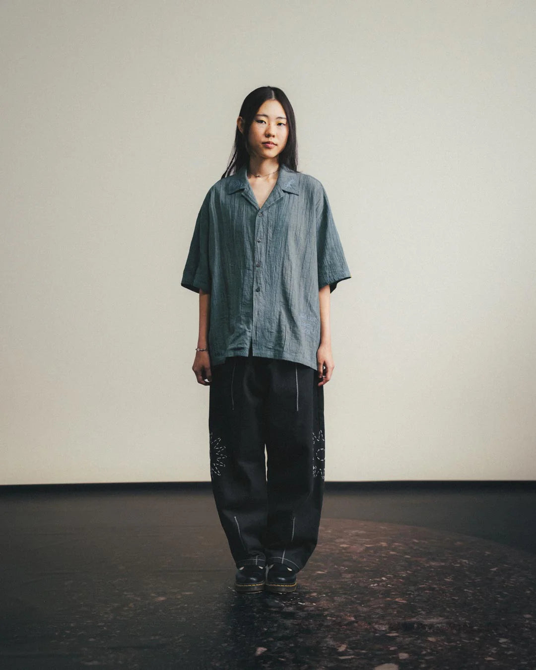 A Eckhaus Latta Shirt pictured on a model in front of a white background. The title of the product is Eckhaus Latta Eclipse Turtleneck - Stone and the image was taken by 199A®.