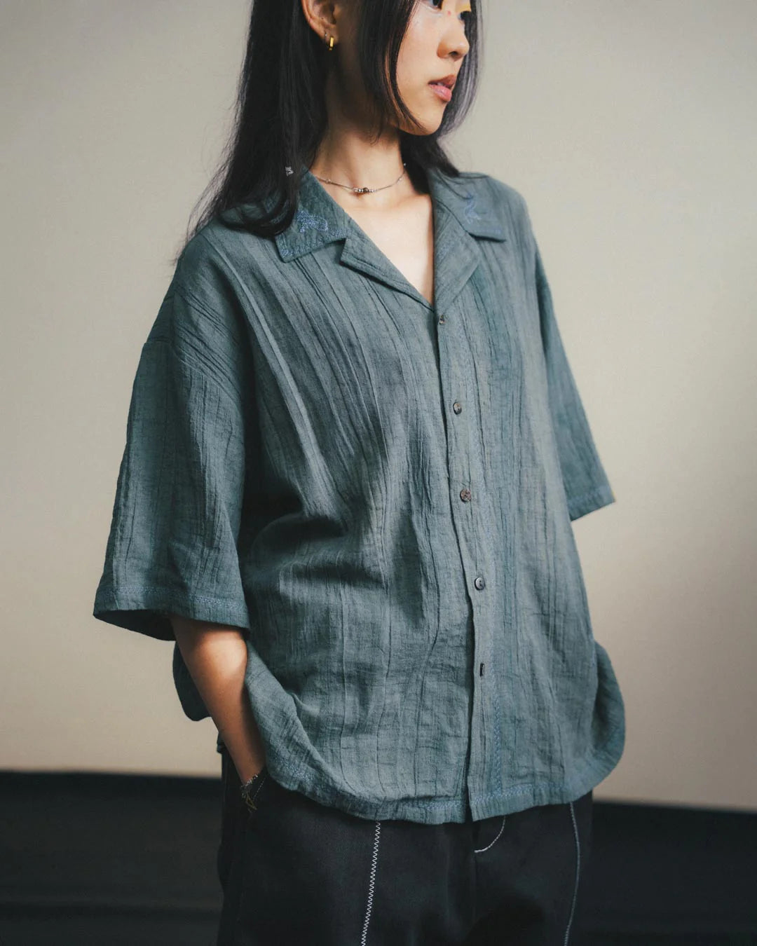 A Eckhaus Latta Shirt pictured on a model in front of a white background. The title of the product is Eckhaus Latta Eclipse Turtleneck - Stone and the image was taken by 199A®.