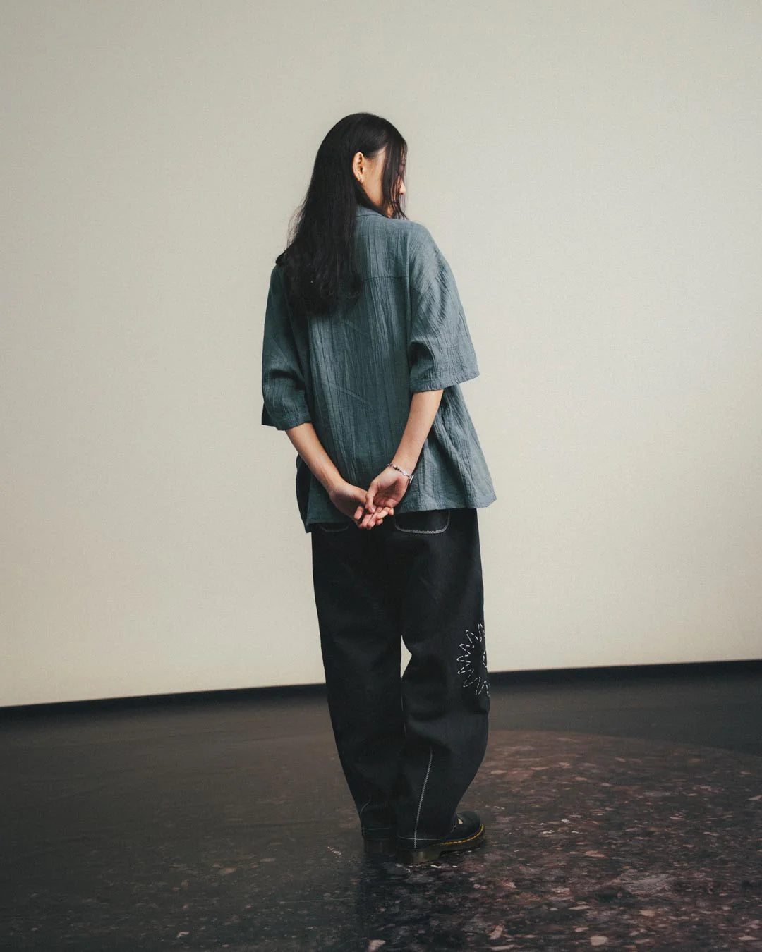 A Eckhaus Latta Shirt pictured on a model in front of a white background. The title of the product is Eckhaus Latta Eclipse Turtleneck - Stone and the image was taken by 199A®.