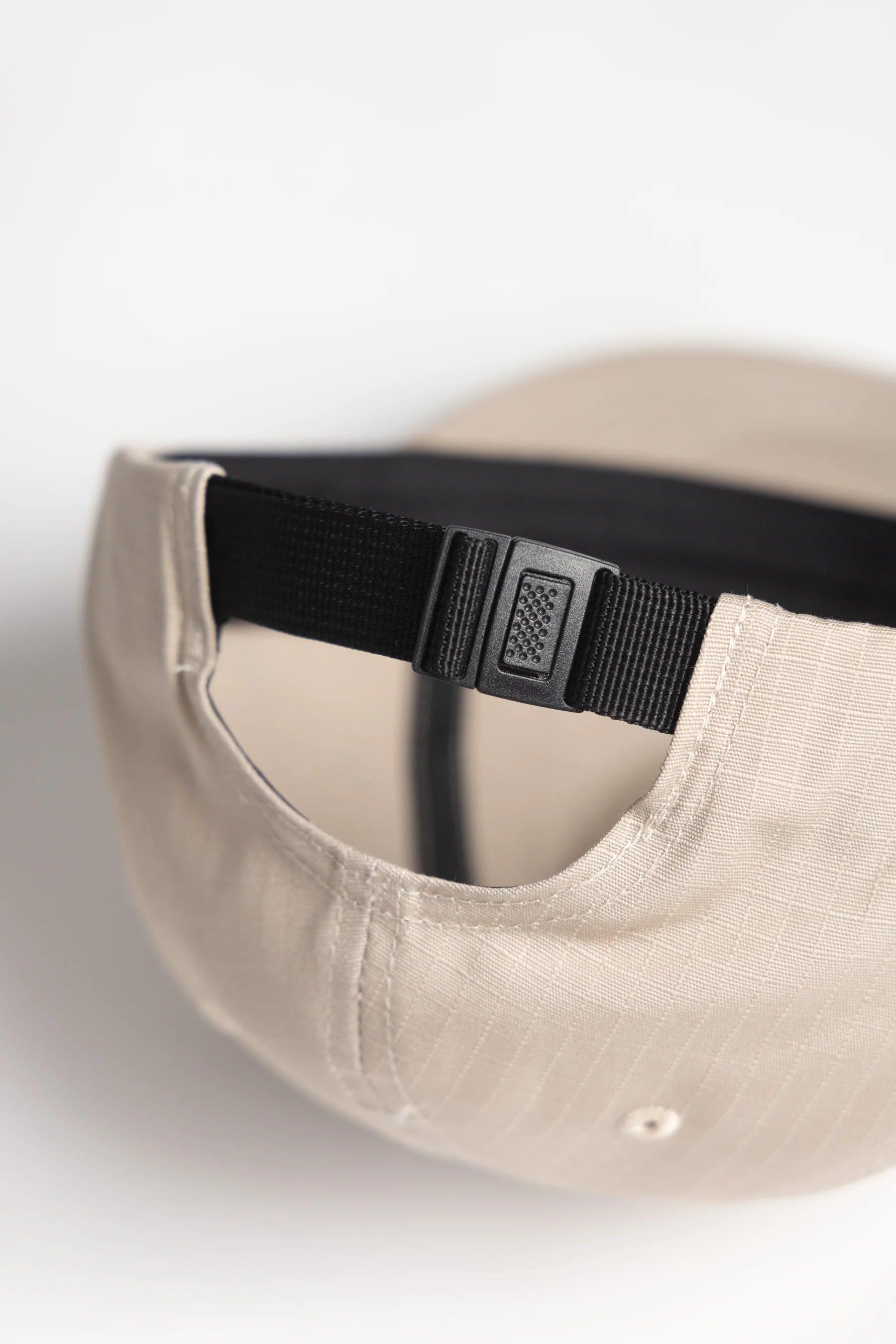 A Eckhaus Latta Shirt pictured on a model in front of a white background. The title of the product is Eckhaus Latta Eclipse Turtleneck - Stone and the image was taken by 199A®.