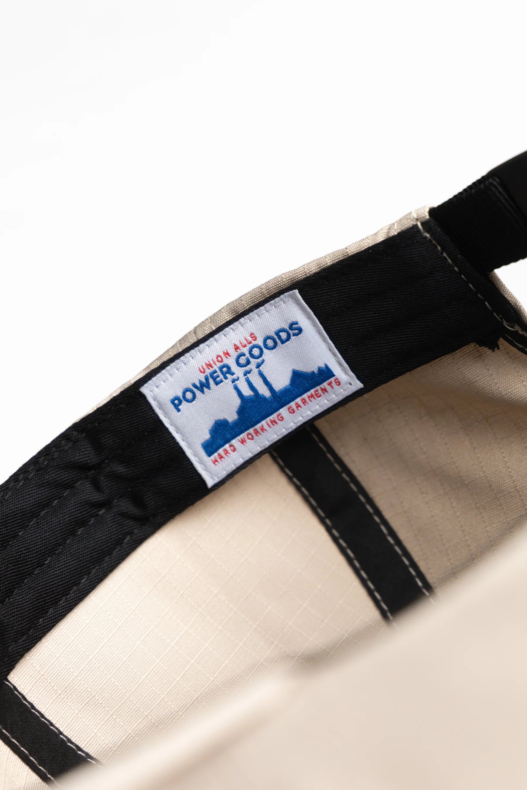 A Eckhaus Latta Shirt pictured on a model in front of a white background. The title of the product is Eckhaus Latta Eclipse Turtleneck - Stone and the image was taken by 199A®.