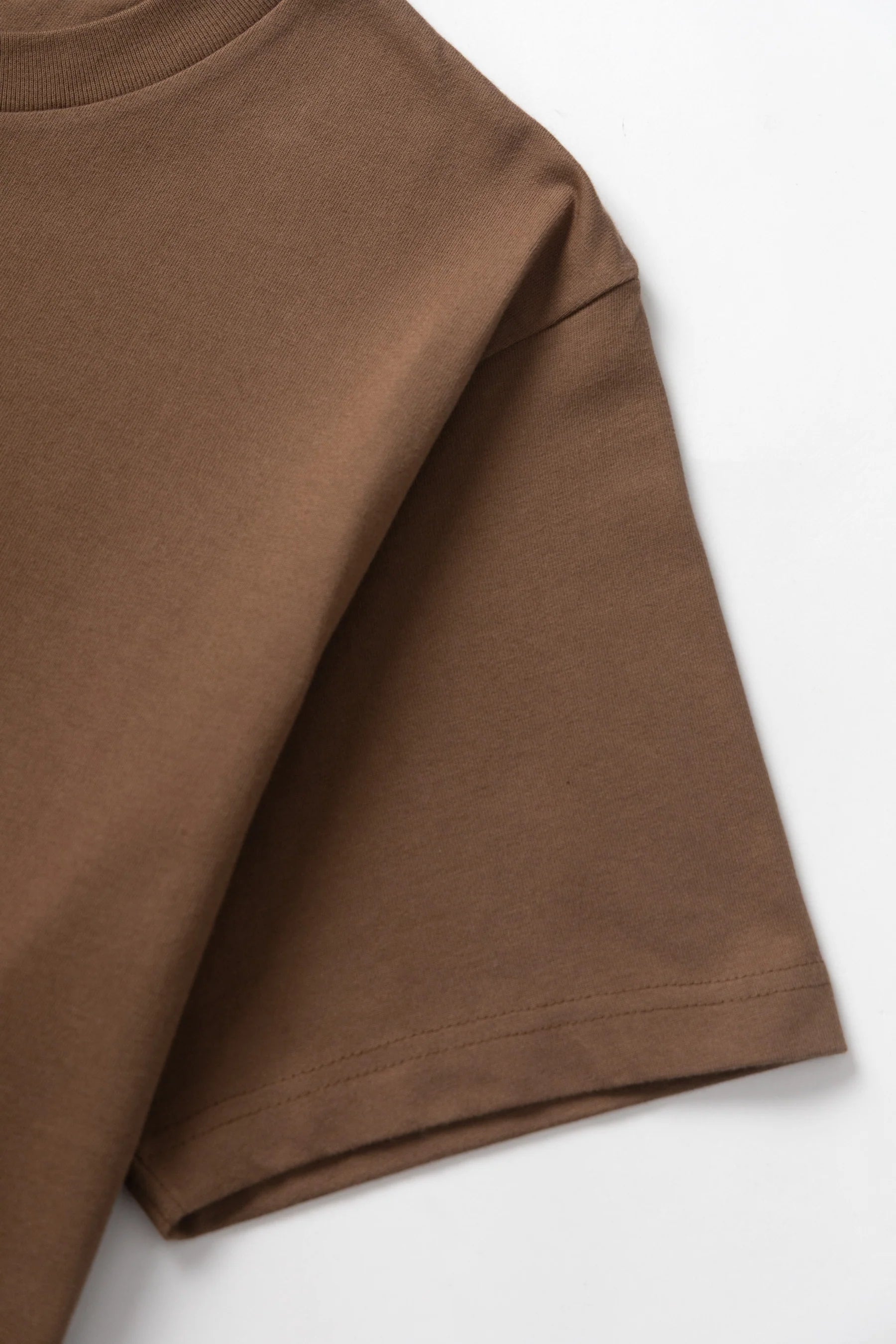 A Eckhaus Latta Shirt pictured on a model in front of a white background. The title of the product is Eckhaus Latta Eclipse Turtleneck - Stone and the image was taken by 199A®.