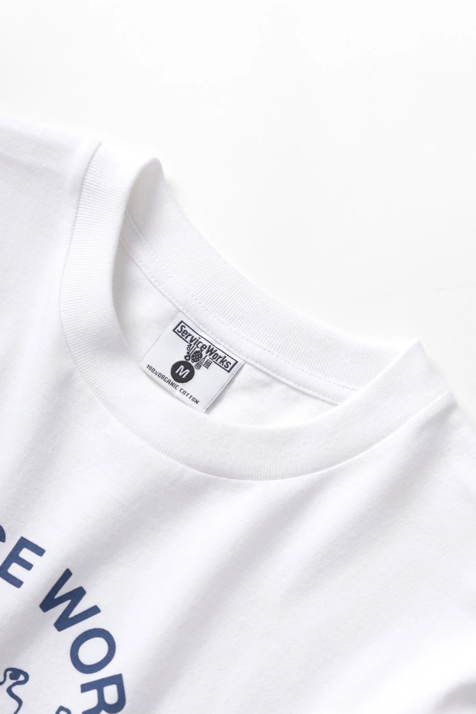 A Eckhaus Latta Shirt pictured on a model in front of a white background. The title of the product is Eckhaus Latta Eclipse Turtleneck - Stone and the image was taken by 199A®.