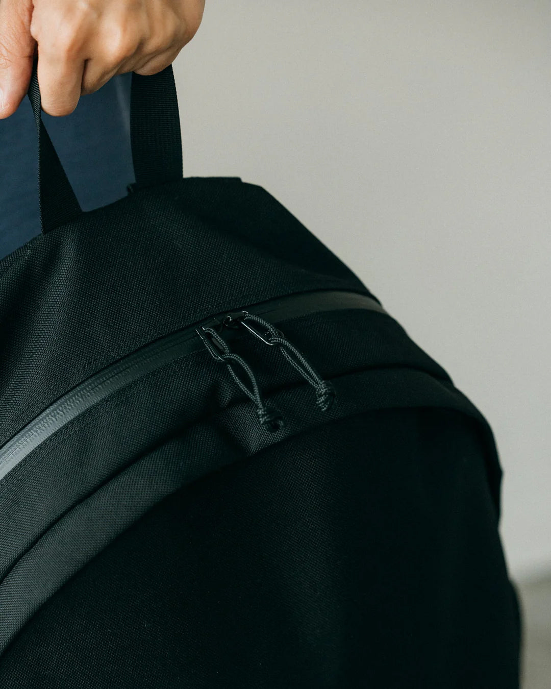 A Eckhaus Latta Shirt pictured on a model in front of a white background. The title of the product is Eckhaus Latta Eclipse Turtleneck - Stone and the image was taken by 199A®.