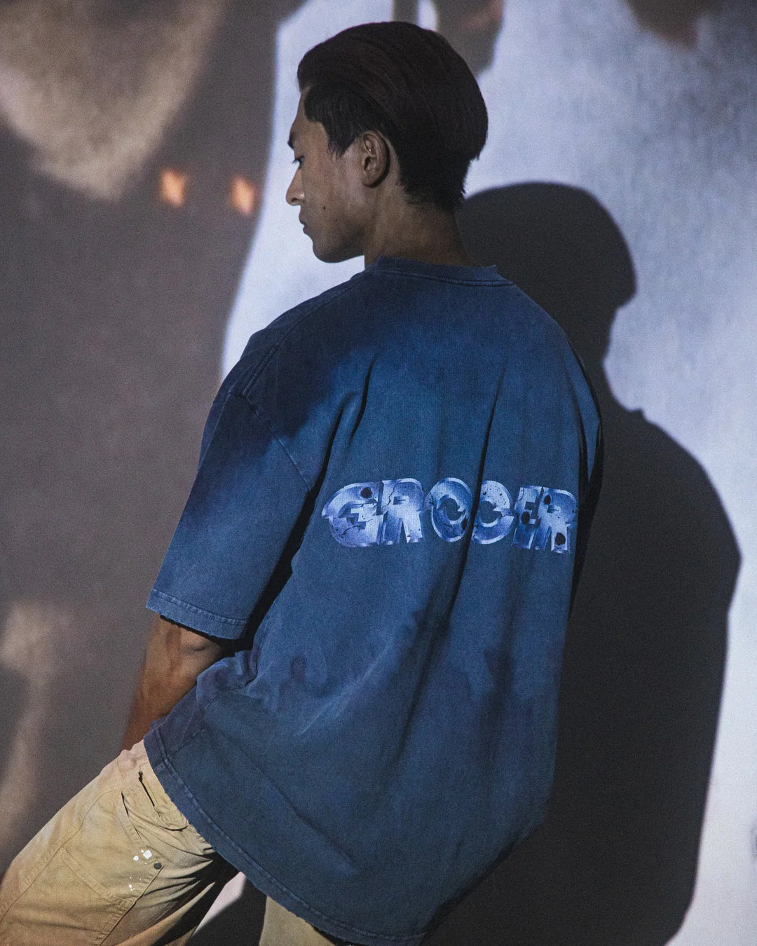 A Eckhaus Latta Shirt pictured on a model in front of a white background. The title of the product is Eckhaus Latta Eclipse Turtleneck - Stone and the image was taken by 199A®.