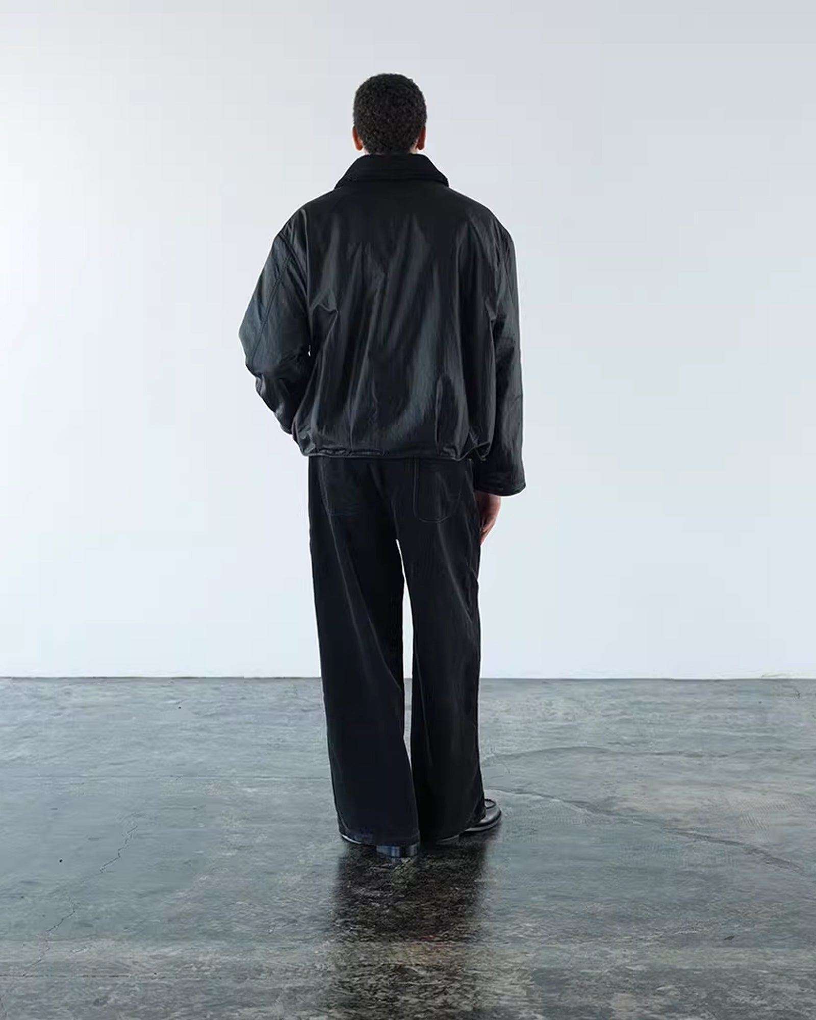 A Eckhaus Latta Shirt pictured on a model in front of a white background. The title of the product is Eckhaus Latta Eclipse Turtleneck - Stone and the image was taken by 199A®.