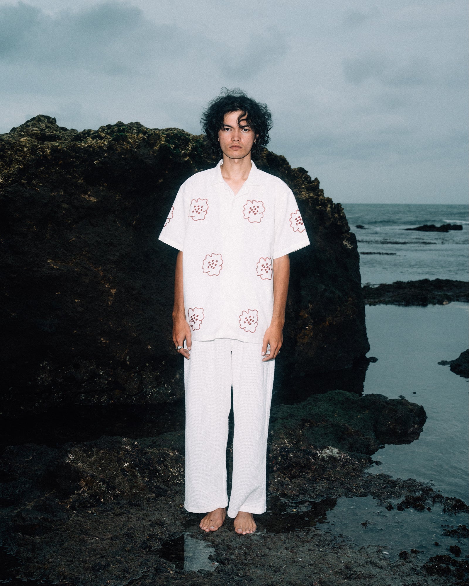 A Eckhaus Latta Shirt pictured on a model in front of a white background. The title of the product is Eckhaus Latta Eclipse Turtleneck - Stone and the image was taken by 199A®.