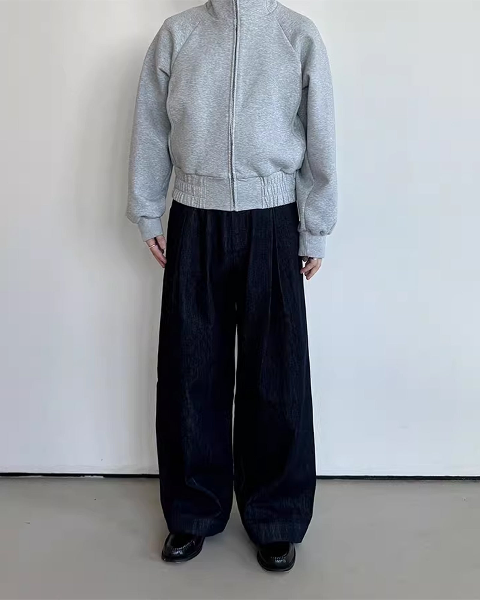 A Eckhaus Latta Shirt pictured on a model in front of a white background. The title of the product is Eckhaus Latta Eclipse Turtleneck - Stone and the image was taken by 199A®.