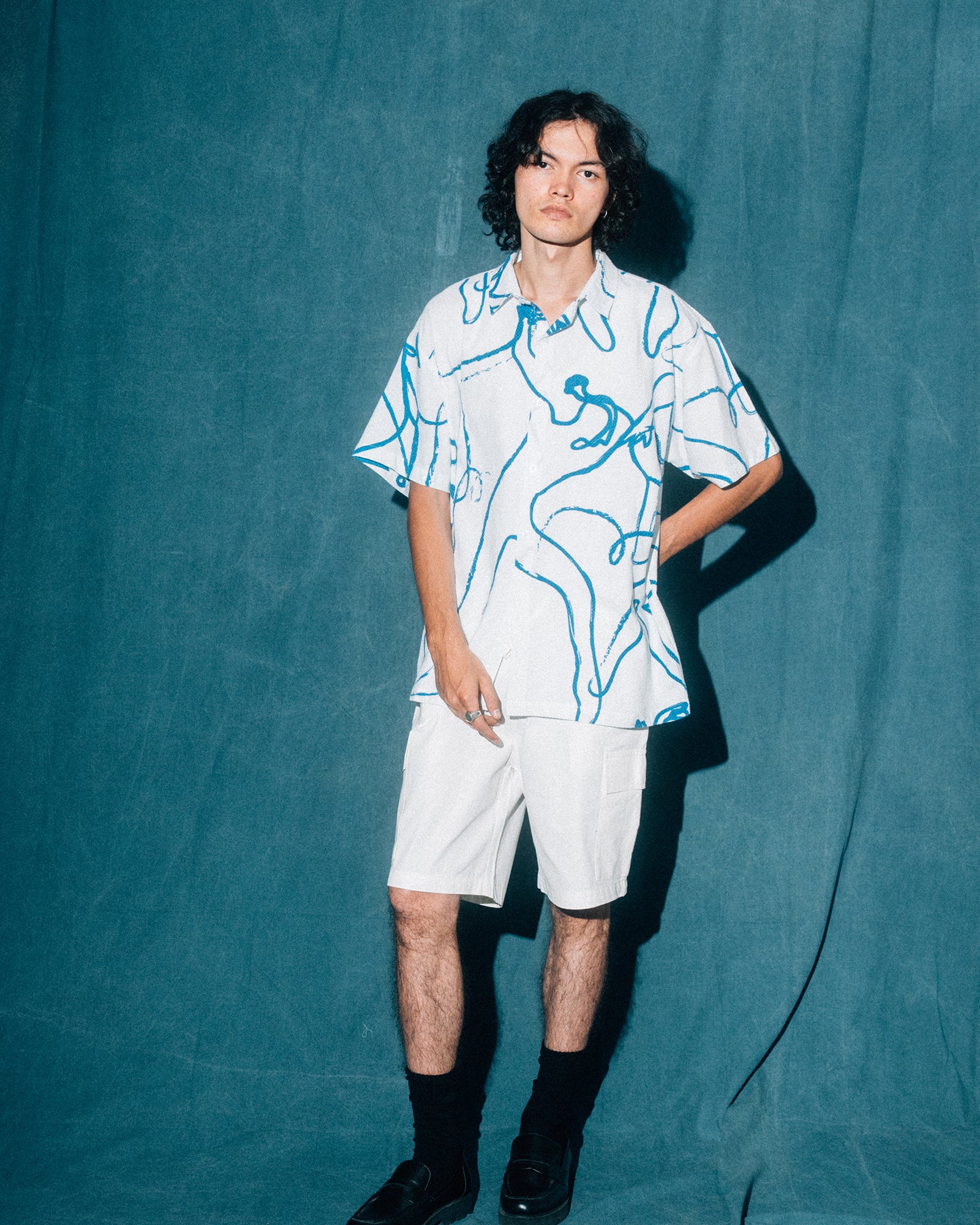 A Eckhaus Latta Shirt pictured on a model in front of a white background. The title of the product is Eckhaus Latta Eclipse Turtleneck - Stone and the image was taken by 199A®.