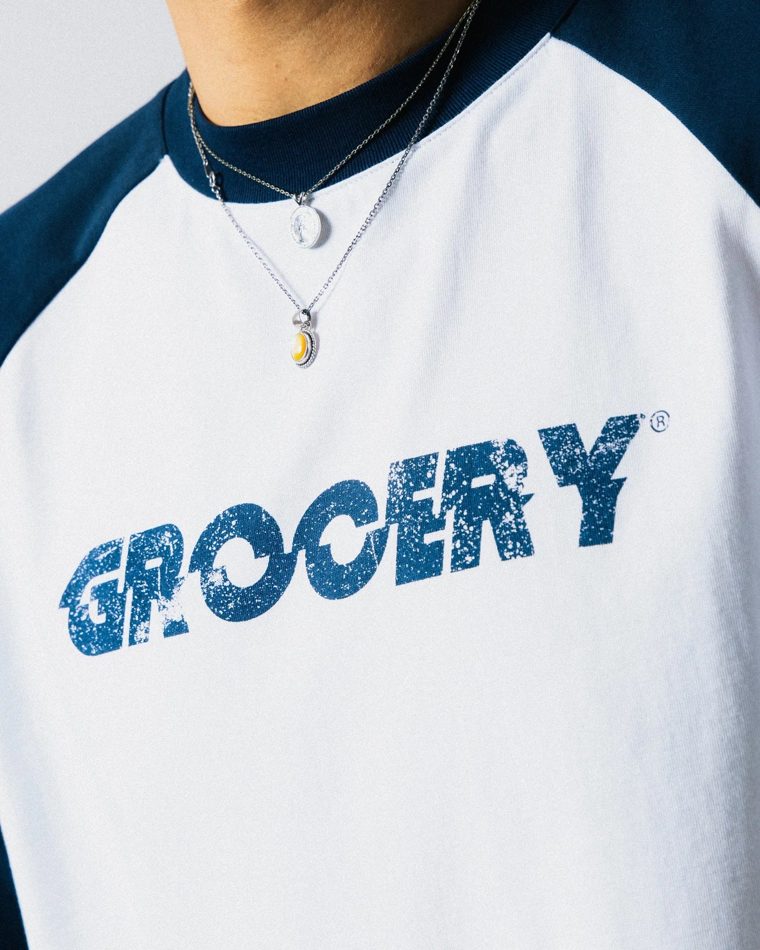 A Eckhaus Latta Shirt pictured on a model in front of a white background. The title of the product is Eckhaus Latta Eclipse Turtleneck - Stone and the image was taken by 199A®.