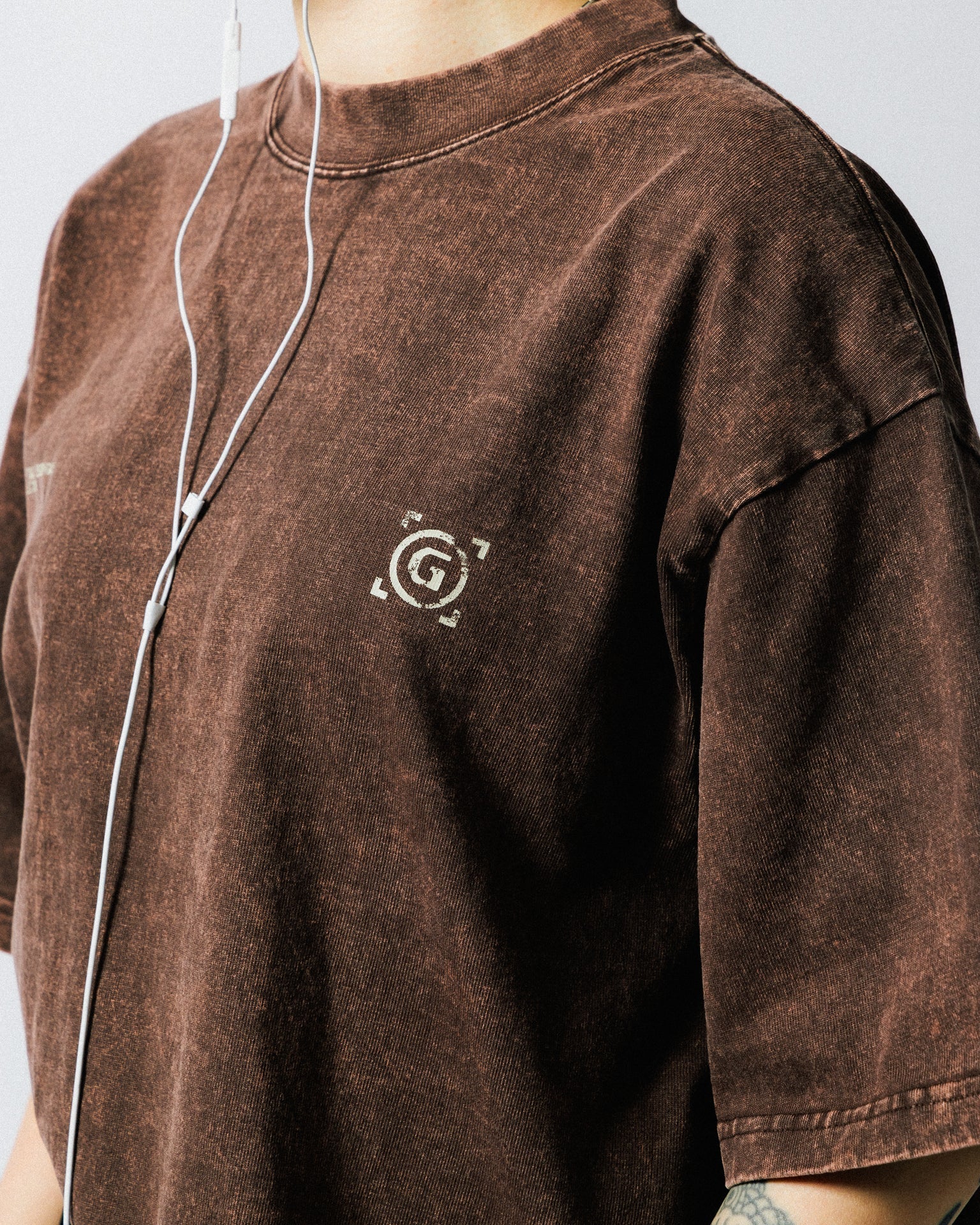 A Eckhaus Latta Shirt pictured on a model in front of a white background. The title of the product is Eckhaus Latta Eclipse Turtleneck - Stone and the image was taken by 199A®.