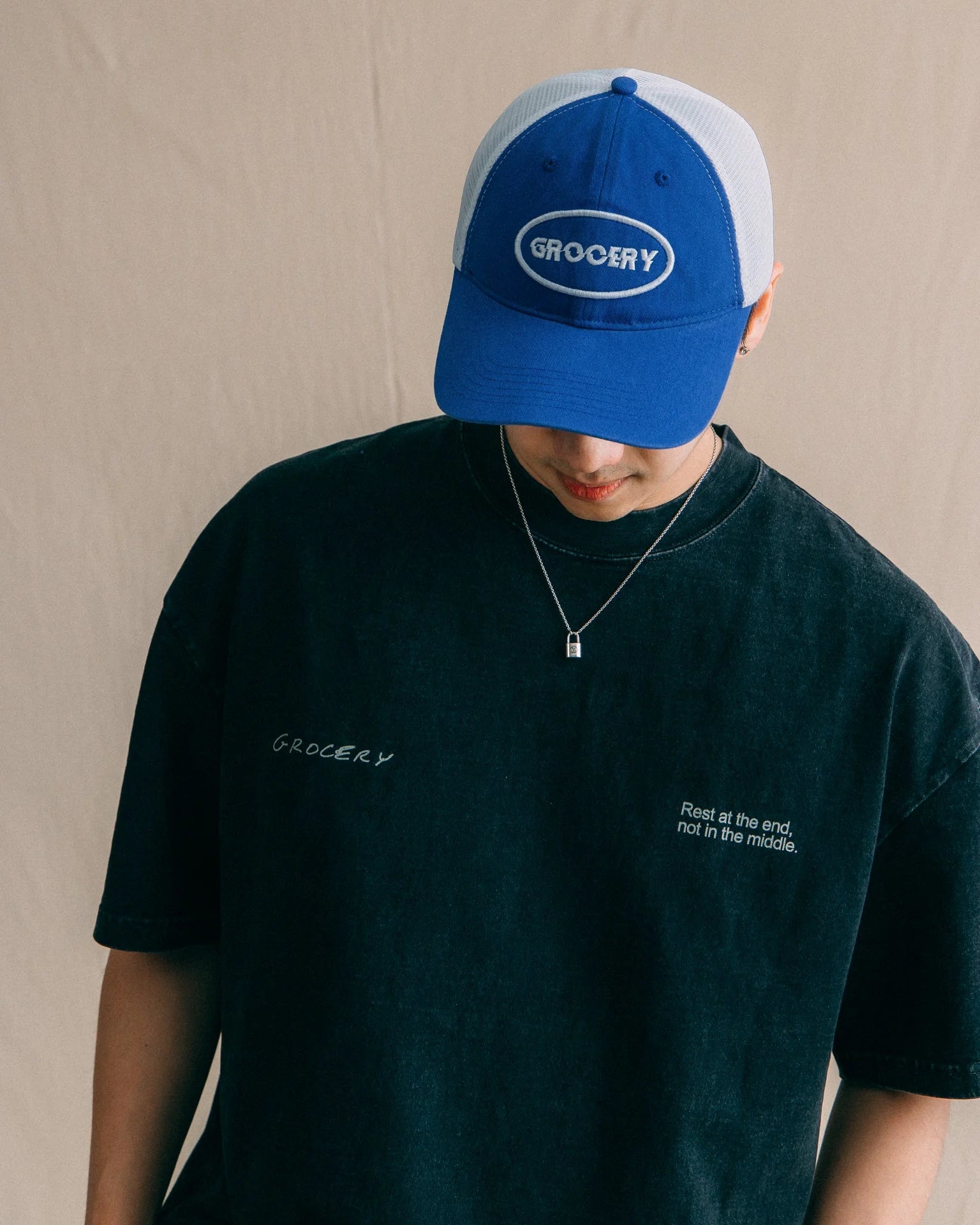 A Eckhaus Latta Shirt pictured on a model in front of a white background. The title of the product is Eckhaus Latta Eclipse Turtleneck - Stone and the image was taken by 199A®.