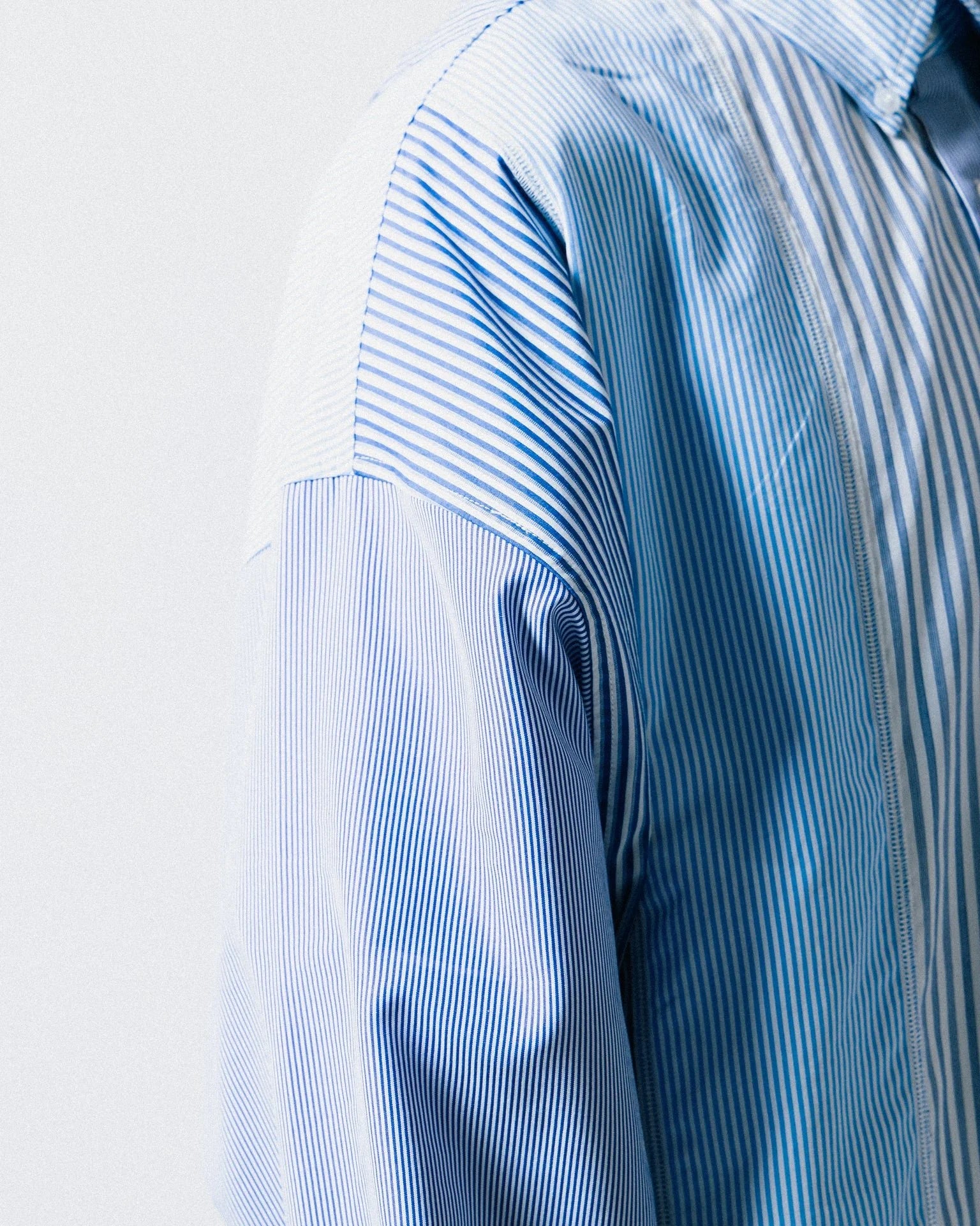 A Eckhaus Latta Shirt pictured on a model in front of a white background. The title of the product is Eckhaus Latta Eclipse Turtleneck - Stone and the image was taken by 199A®.