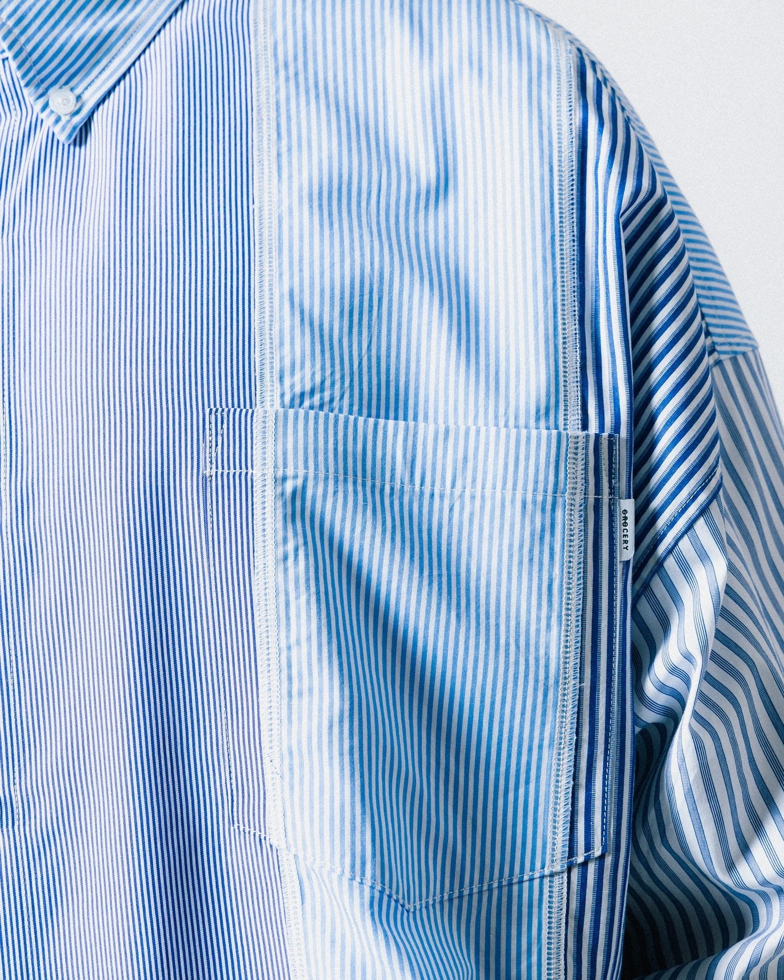 A Eckhaus Latta Shirt pictured on a model in front of a white background. The title of the product is Eckhaus Latta Eclipse Turtleneck - Stone and the image was taken by 199A®.