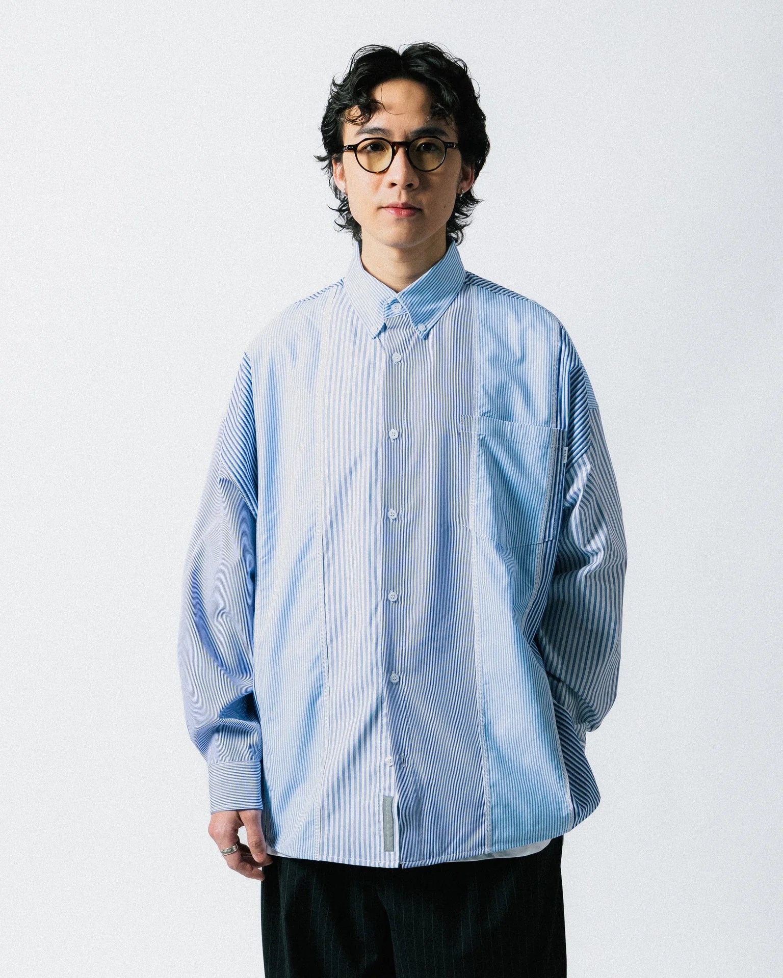 A Eckhaus Latta Shirt pictured on a model in front of a white background. The title of the product is Eckhaus Latta Eclipse Turtleneck - Stone and the image was taken by 199A®.