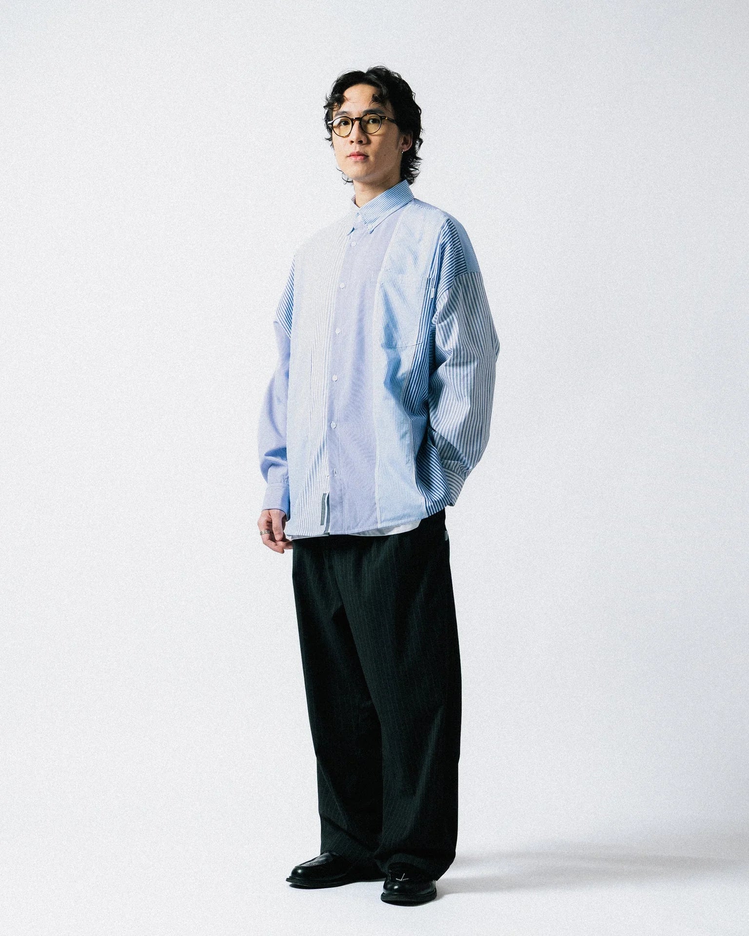 A Eckhaus Latta Shirt pictured on a model in front of a white background. The title of the product is Eckhaus Latta Eclipse Turtleneck - Stone and the image was taken by 199A®.