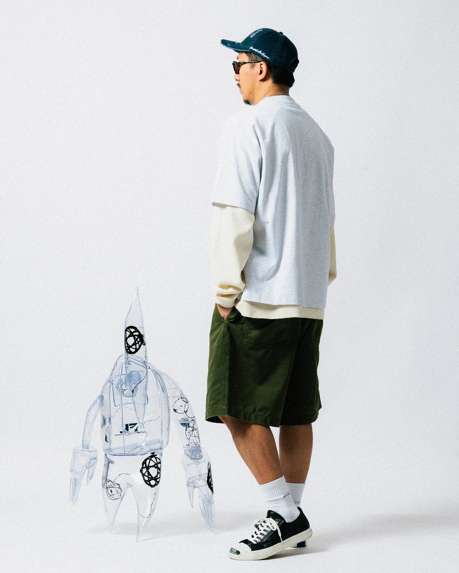 A Eckhaus Latta Shirt pictured on a model in front of a white background. The title of the product is Eckhaus Latta Eclipse Turtleneck - Stone and the image was taken by 199A®.