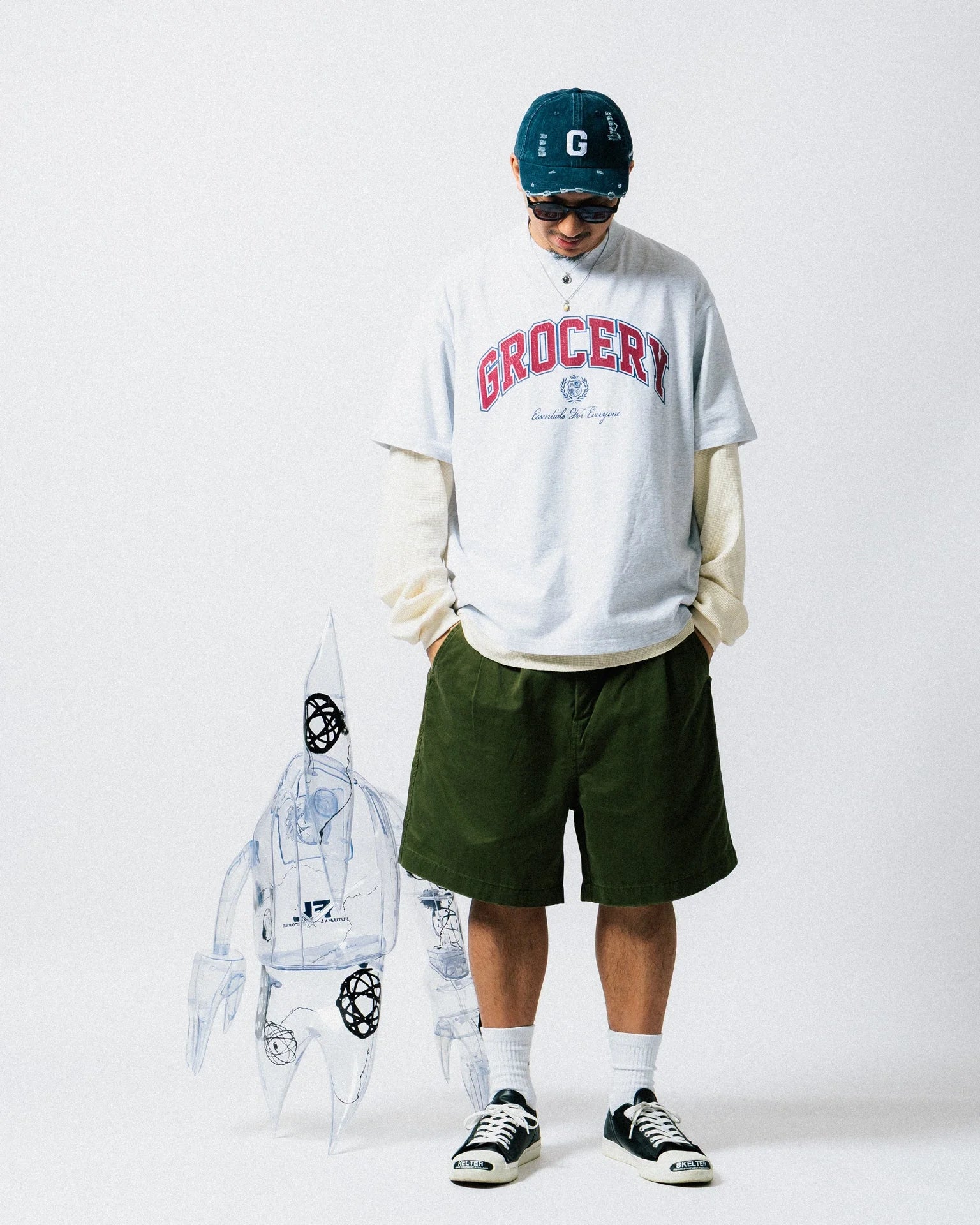 A Eckhaus Latta Shirt pictured on a model in front of a white background. The title of the product is Eckhaus Latta Eclipse Turtleneck - Stone and the image was taken by 199A®.