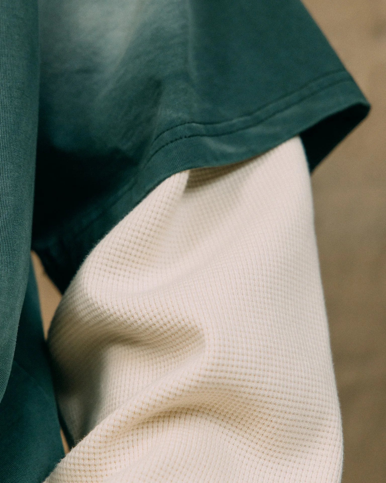 A Eckhaus Latta Shirt pictured on a model in front of a white background. The title of the product is Eckhaus Latta Eclipse Turtleneck - Stone and the image was taken by 199A®.