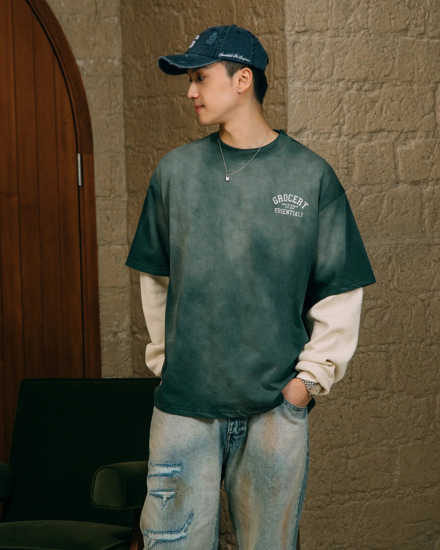 A Eckhaus Latta Shirt pictured on a model in front of a white background. The title of the product is Eckhaus Latta Eclipse Turtleneck - Stone and the image was taken by 199A®.