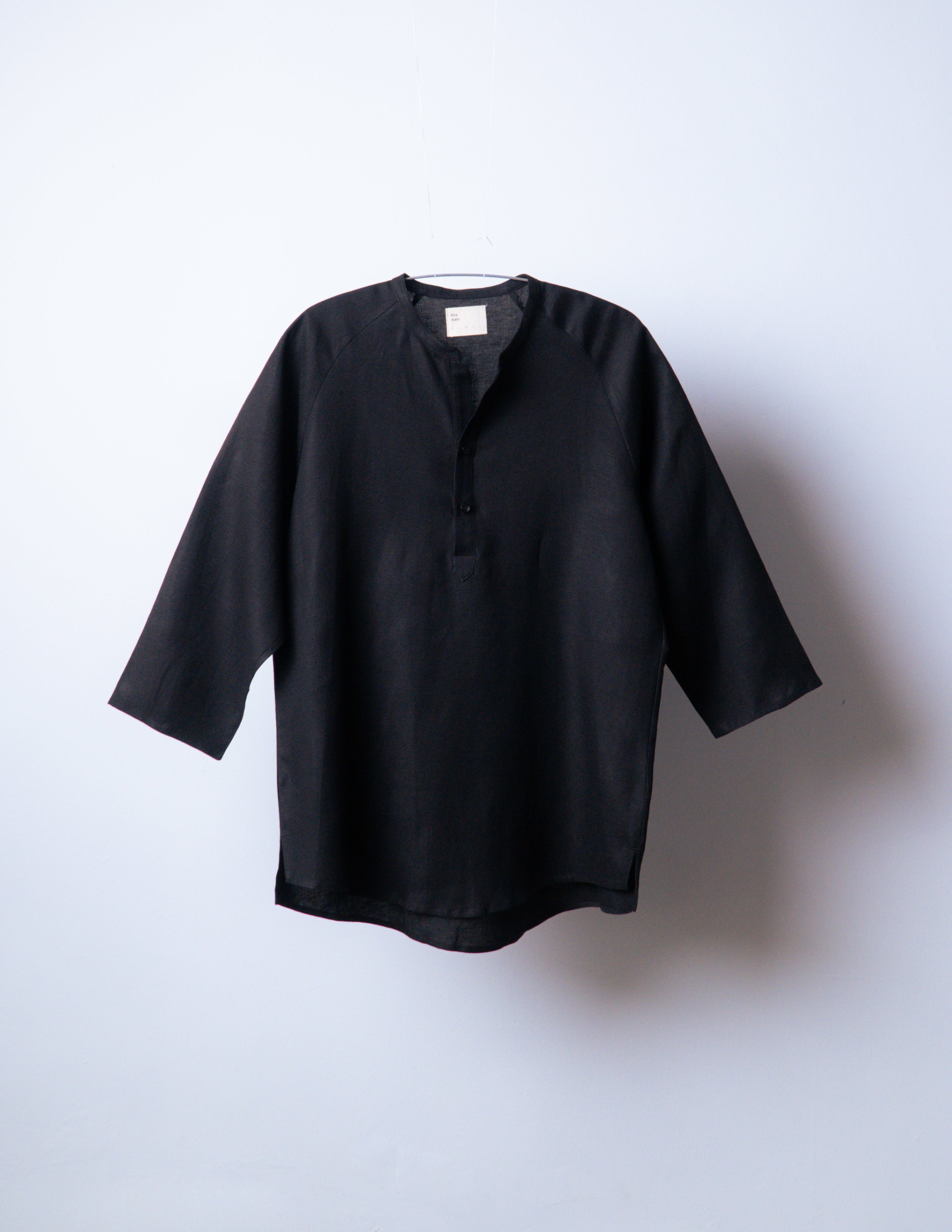A Eckhaus Latta Shirt pictured on a model in front of a white background. The title of the product is Eckhaus Latta Eclipse Turtleneck - Stone and the image was taken by 199A®.