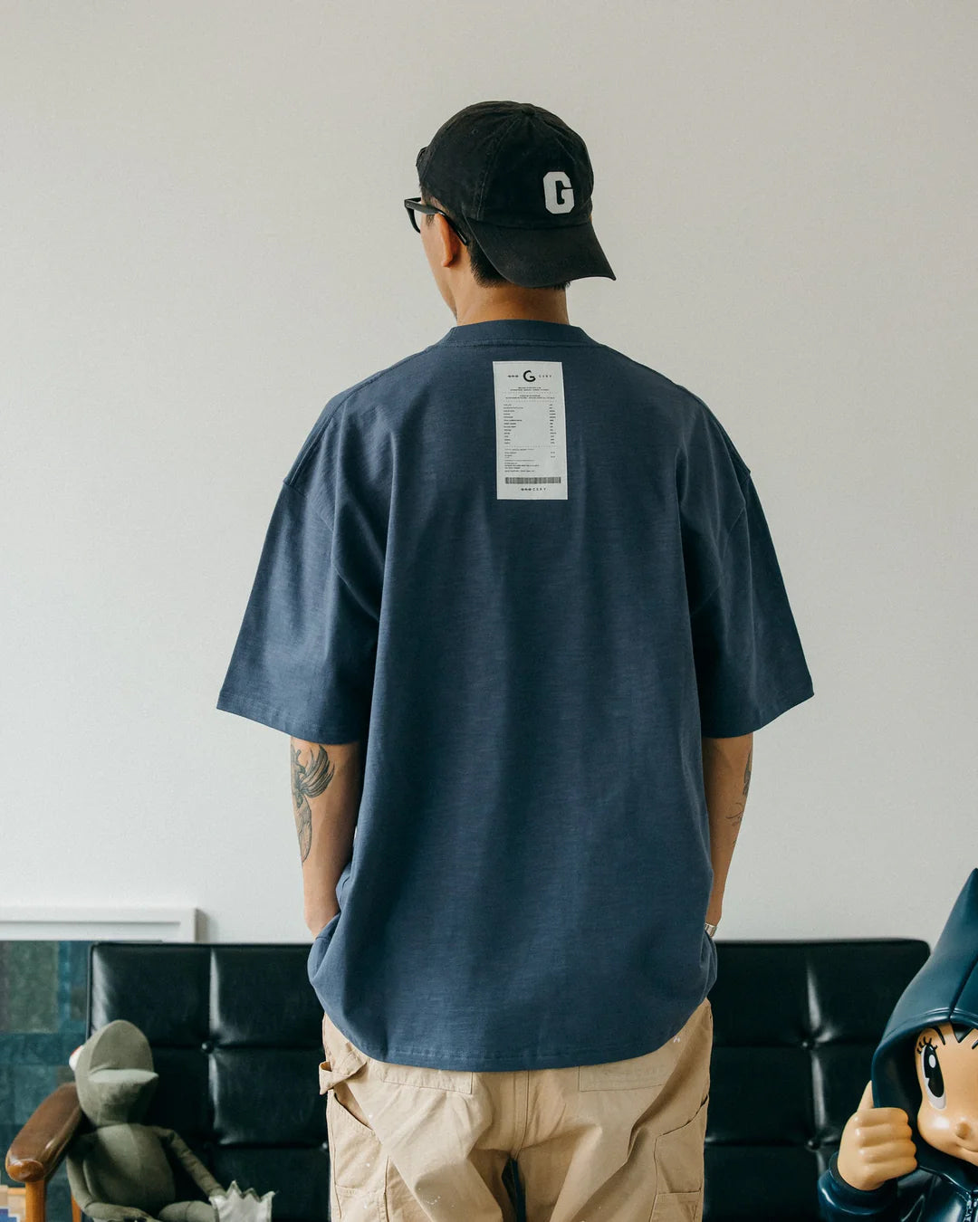 A Eckhaus Latta Shirt pictured on a model in front of a white background. The title of the product is Eckhaus Latta Eclipse Turtleneck - Stone and the image was taken by 199A®.