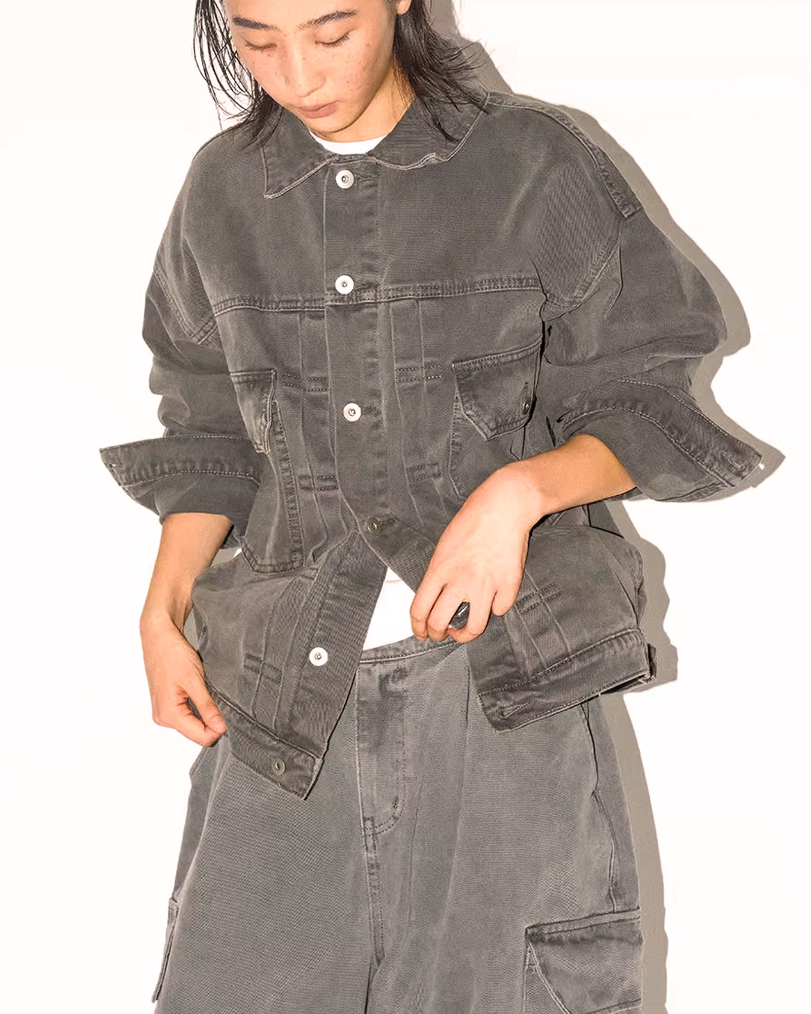 A Eckhaus Latta Shirt pictured on a model in front of a white background. The title of the product is Eckhaus Latta Eclipse Turtleneck - Stone and the image was taken by 199A®.