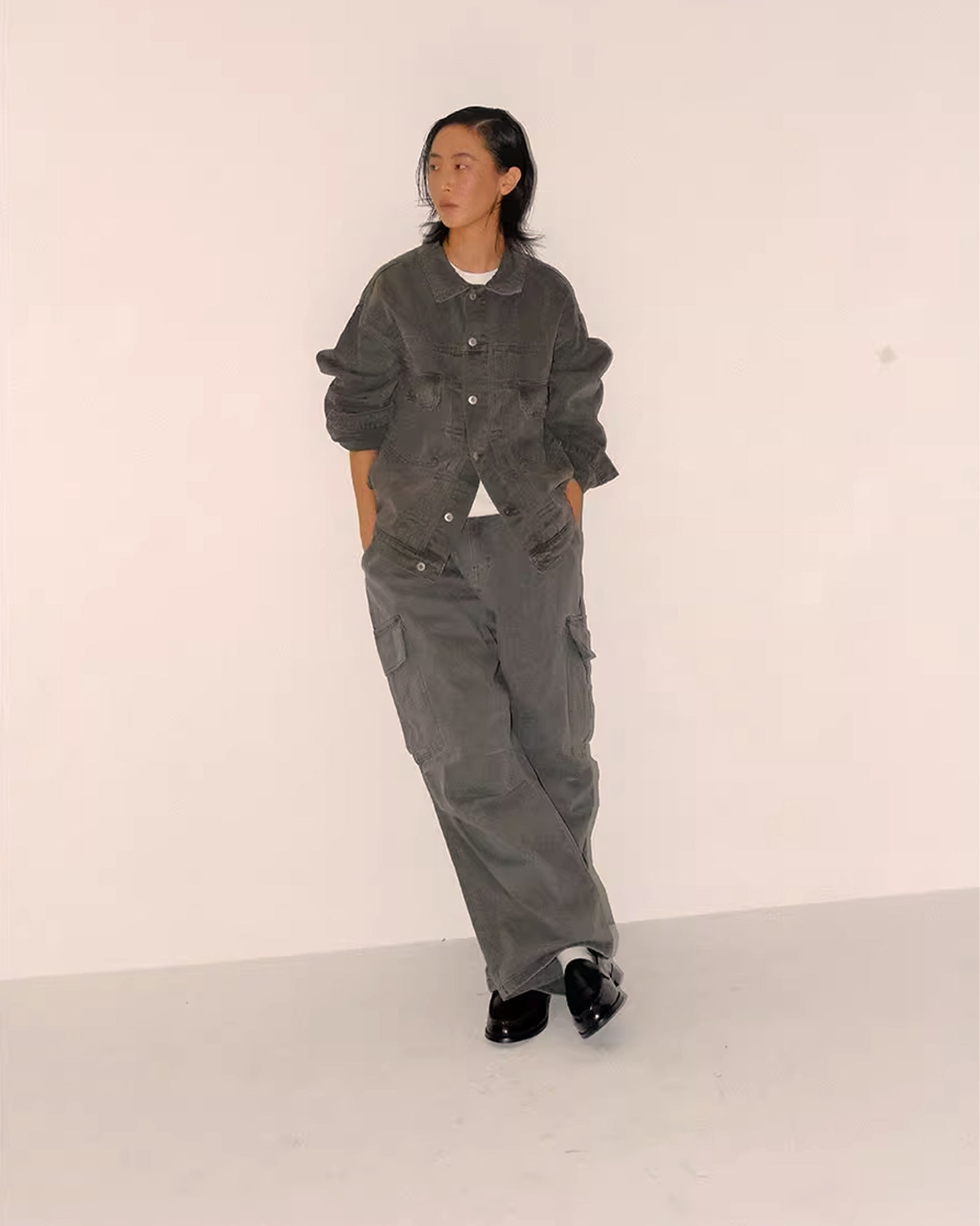 A Eckhaus Latta Shirt pictured on a model in front of a white background. The title of the product is Eckhaus Latta Eclipse Turtleneck - Stone and the image was taken by 199A®.