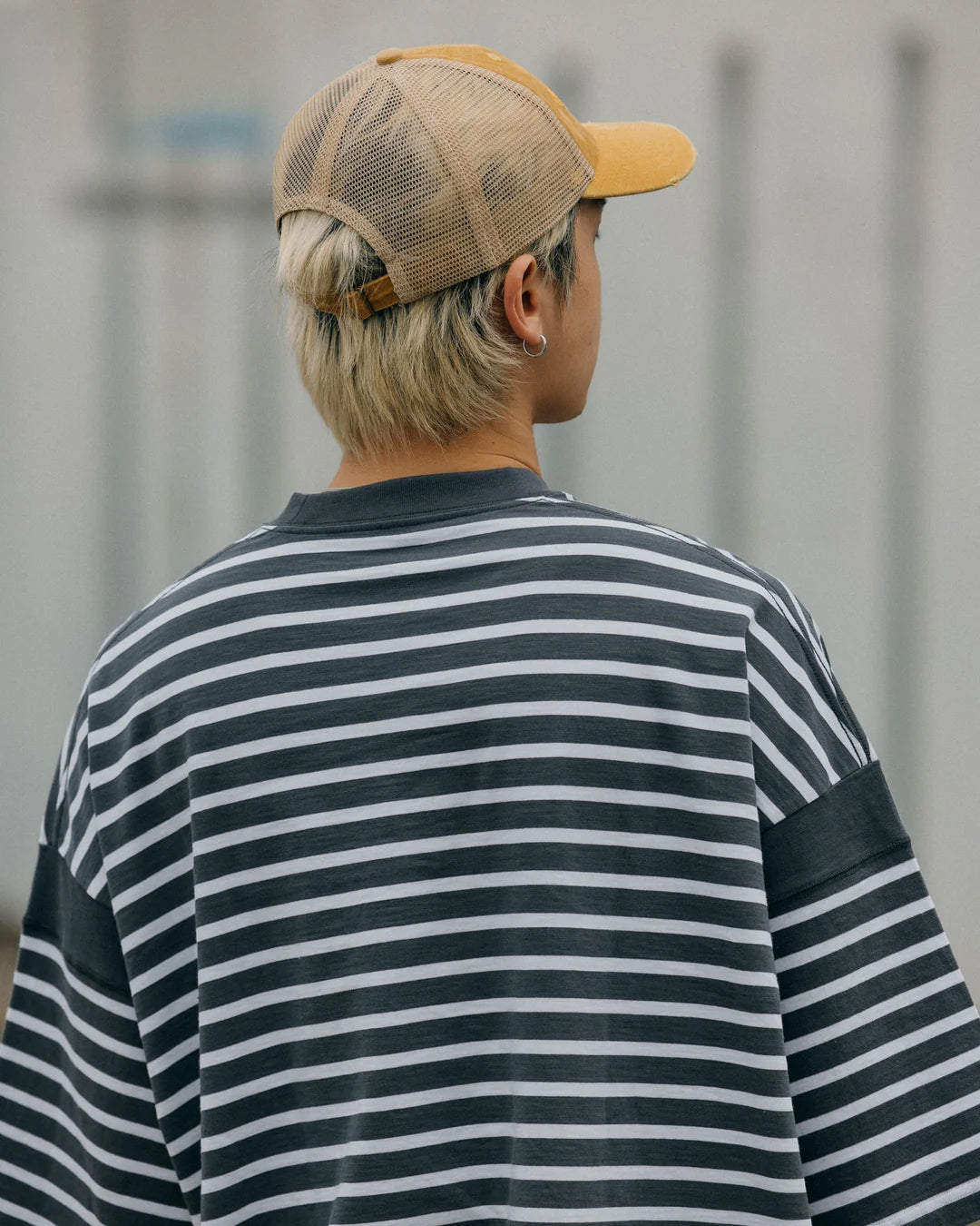 A Eckhaus Latta Shirt pictured on a model in front of a white background. The title of the product is Eckhaus Latta Eclipse Turtleneck - Stone and the image was taken by 199A®.