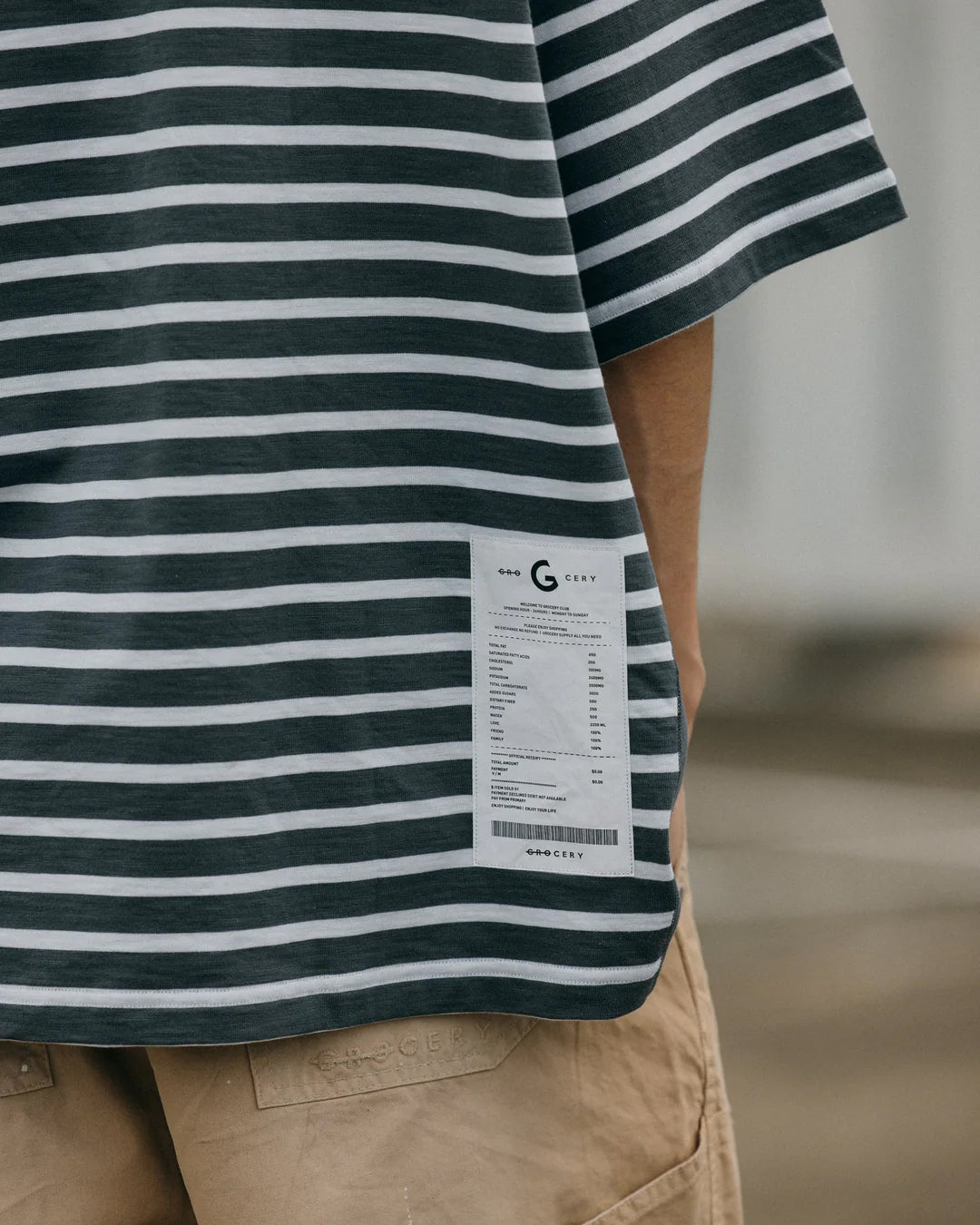 A Eckhaus Latta Shirt pictured on a model in front of a white background. The title of the product is Eckhaus Latta Eclipse Turtleneck - Stone and the image was taken by 199A®.