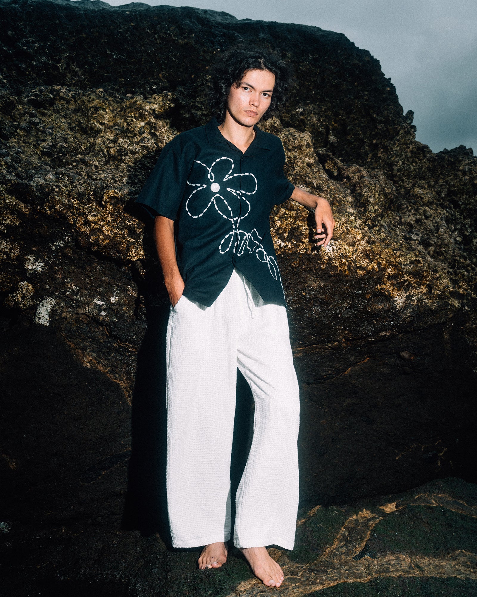 A Eckhaus Latta Shirt pictured on a model in front of a white background. The title of the product is Eckhaus Latta Eclipse Turtleneck - Stone and the image was taken by 199A®.