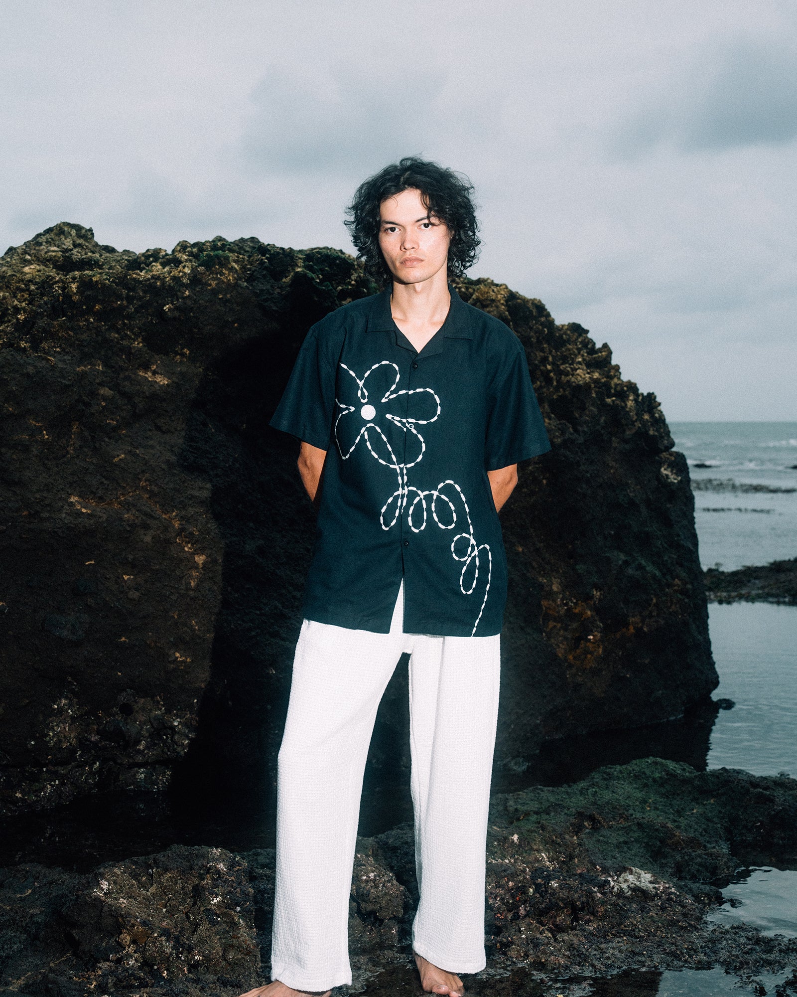 A Eckhaus Latta Shirt pictured on a model in front of a white background. The title of the product is Eckhaus Latta Eclipse Turtleneck - Stone and the image was taken by 199A®.