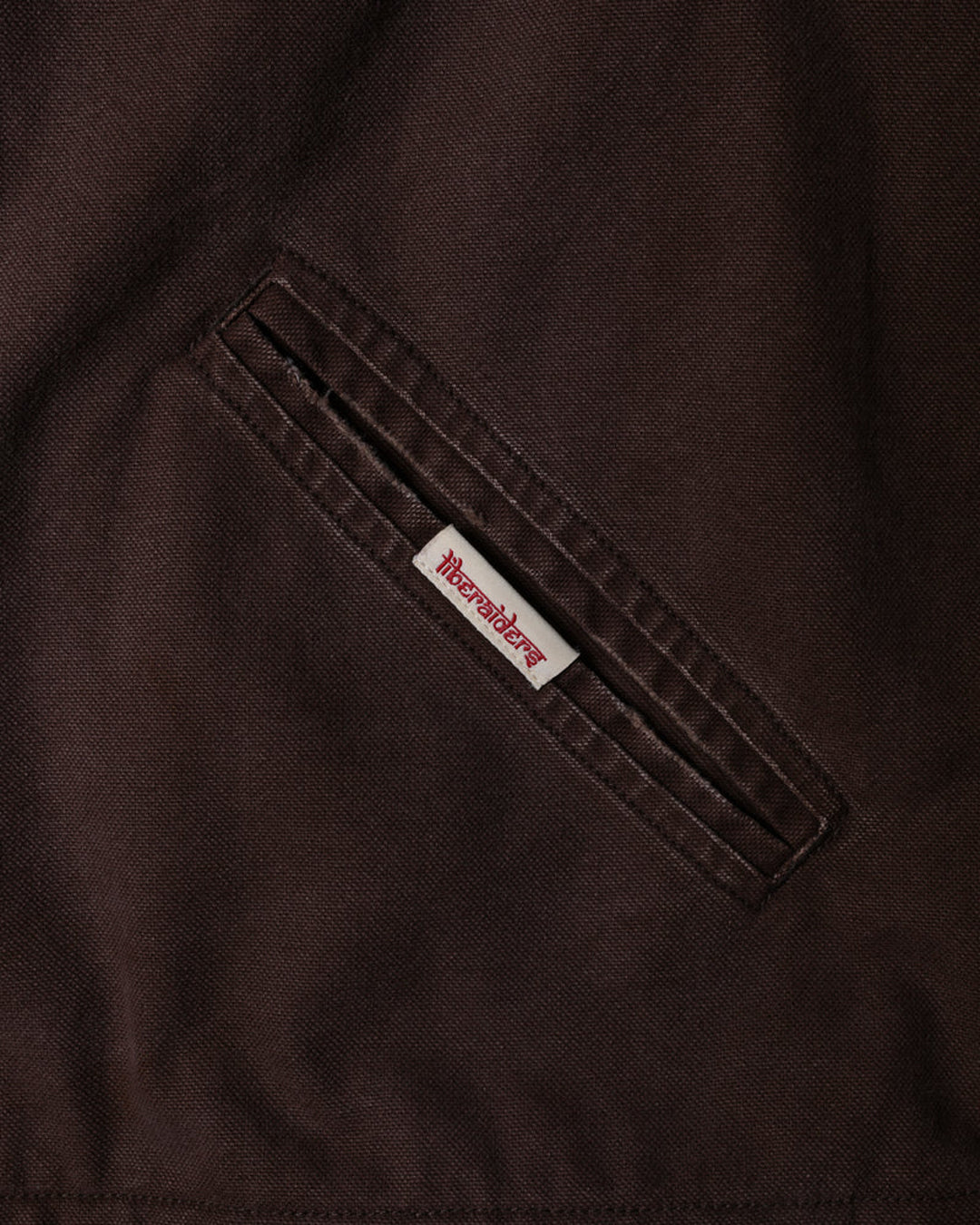 A Eckhaus Latta Shirt pictured on a model in front of a white background. The title of the product is Eckhaus Latta Eclipse Turtleneck - Stone and the image was taken by 199A®.