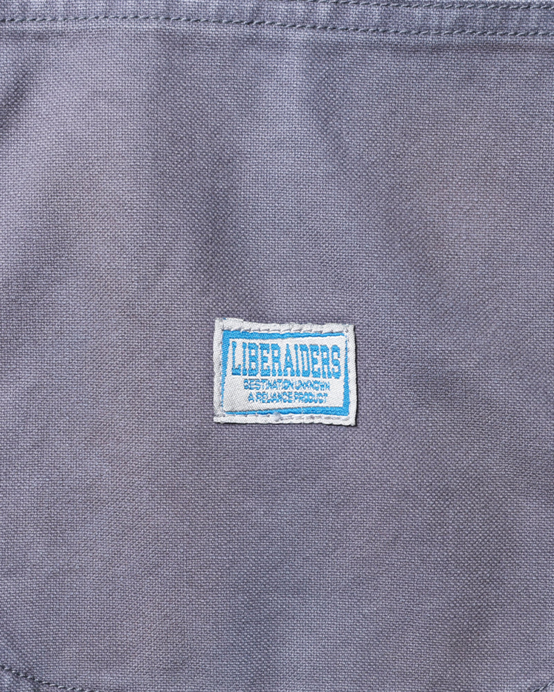 A Eckhaus Latta Shirt pictured on a model in front of a white background. The title of the product is Eckhaus Latta Eclipse Turtleneck - Stone and the image was taken by 199A®.