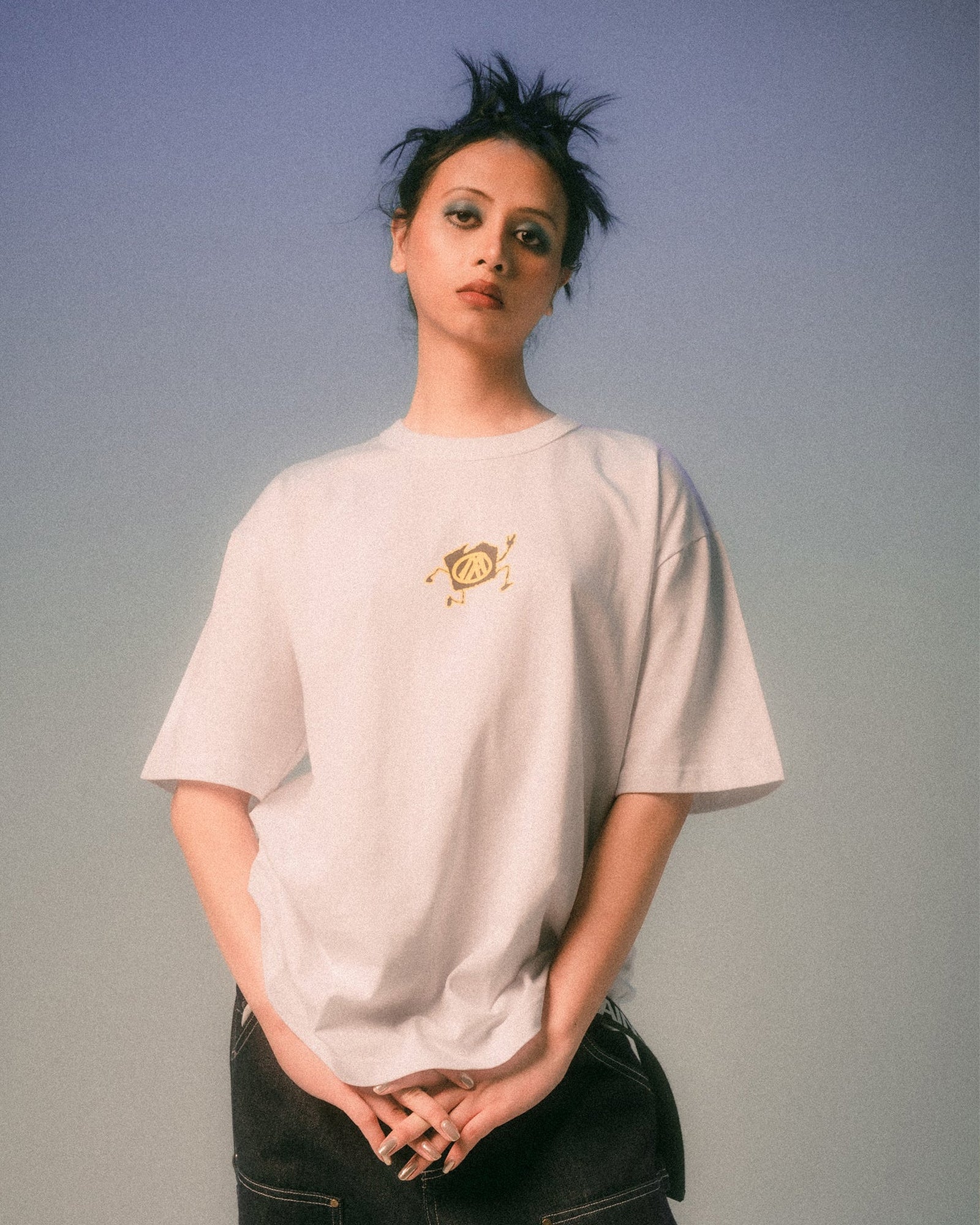 A Eckhaus Latta Shirt pictured on a model in front of a white background. The title of the product is Eckhaus Latta Eclipse Turtleneck - Stone and the image was taken by 199A®.