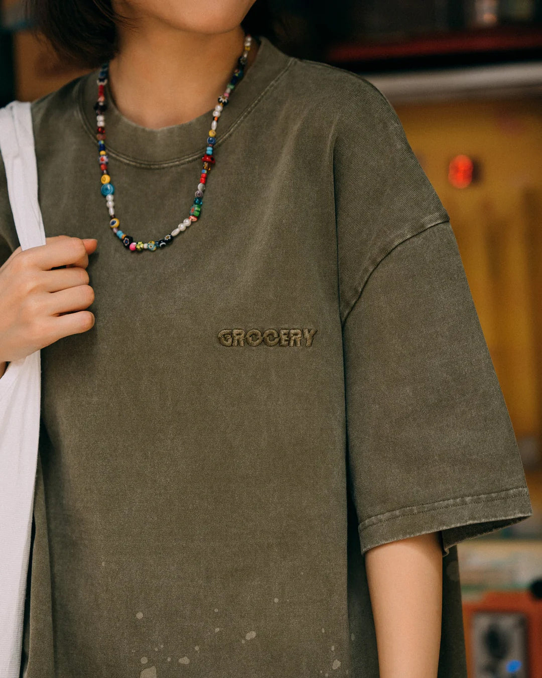 A Eckhaus Latta Shirt pictured on a model in front of a white background. The title of the product is Eckhaus Latta Eclipse Turtleneck - Stone and the image was taken by 199A®.