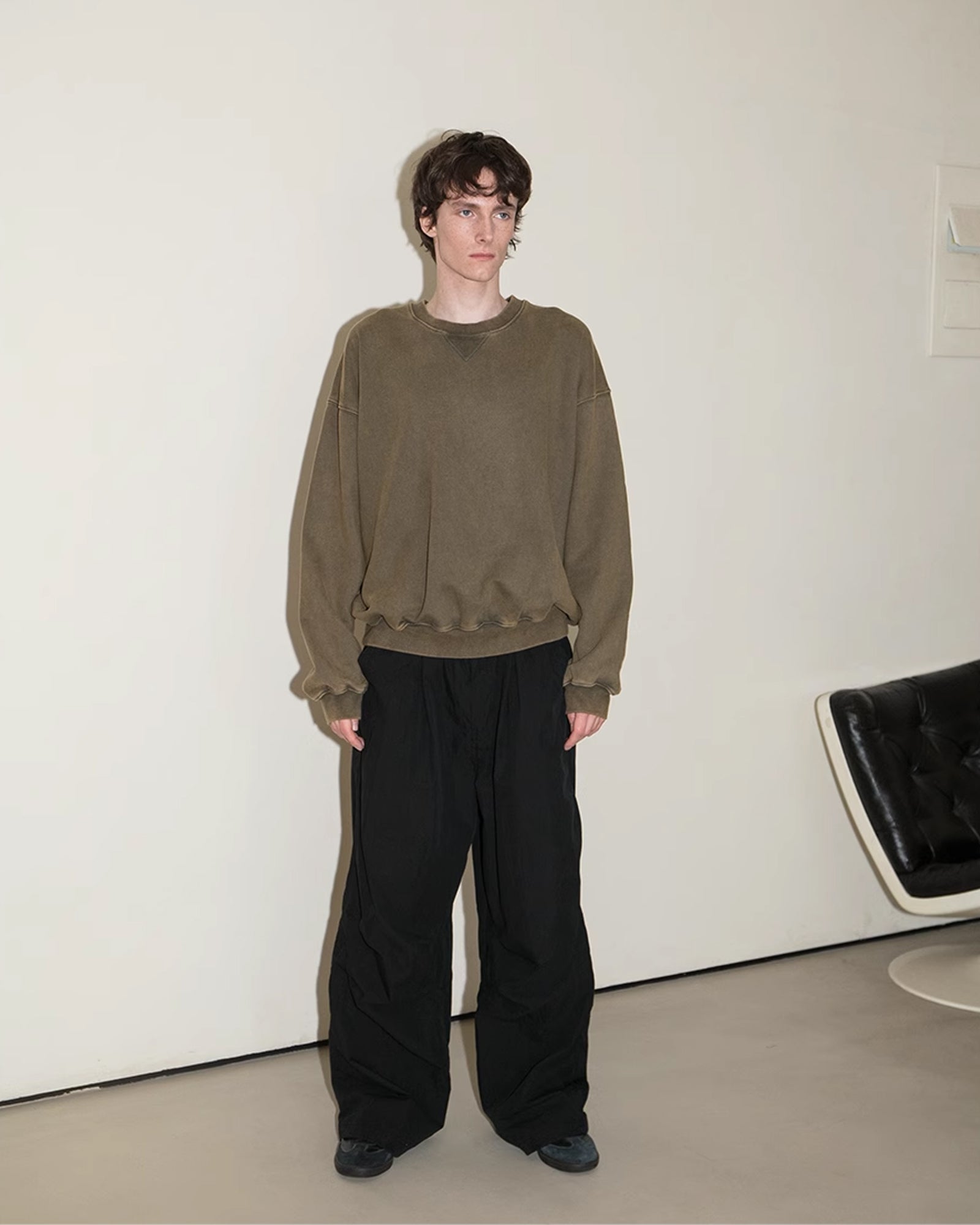 A Eckhaus Latta Shirt pictured on a model in front of a white background. The title of the product is Eckhaus Latta Eclipse Turtleneck - Stone and the image was taken by 199A®.