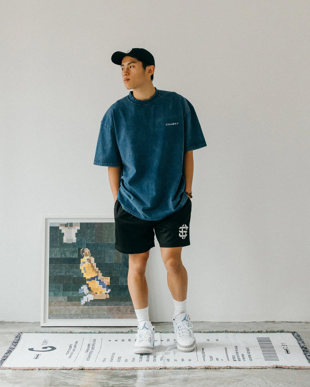 A Eckhaus Latta Shirt pictured on a model in front of a white background. The title of the product is Eckhaus Latta Eclipse Turtleneck - Stone and the image was taken by 199A®.