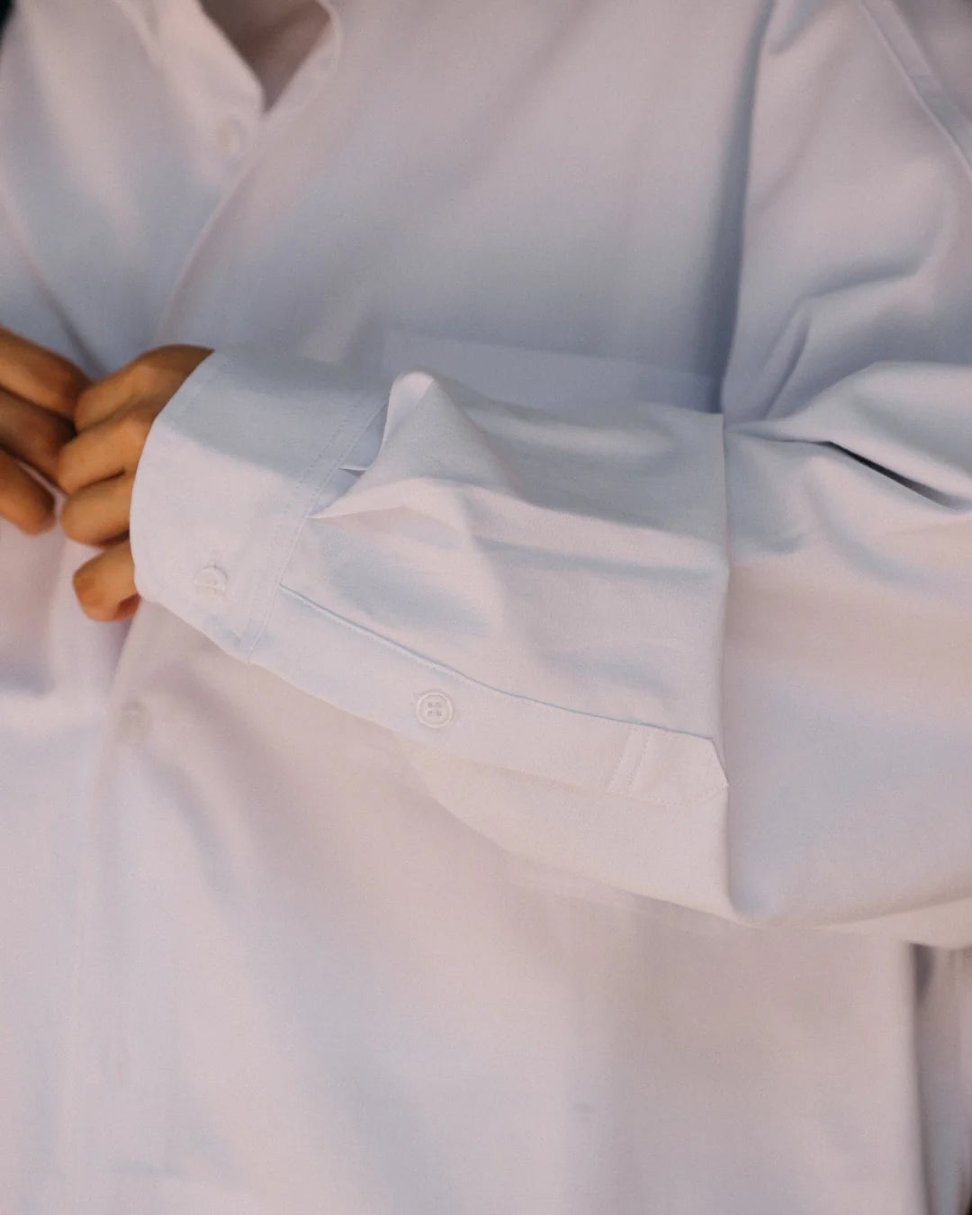 A Eckhaus Latta Shirt pictured on a model in front of a white background. The title of the product is Eckhaus Latta Eclipse Turtleneck - Stone and the image was taken by 199A®.